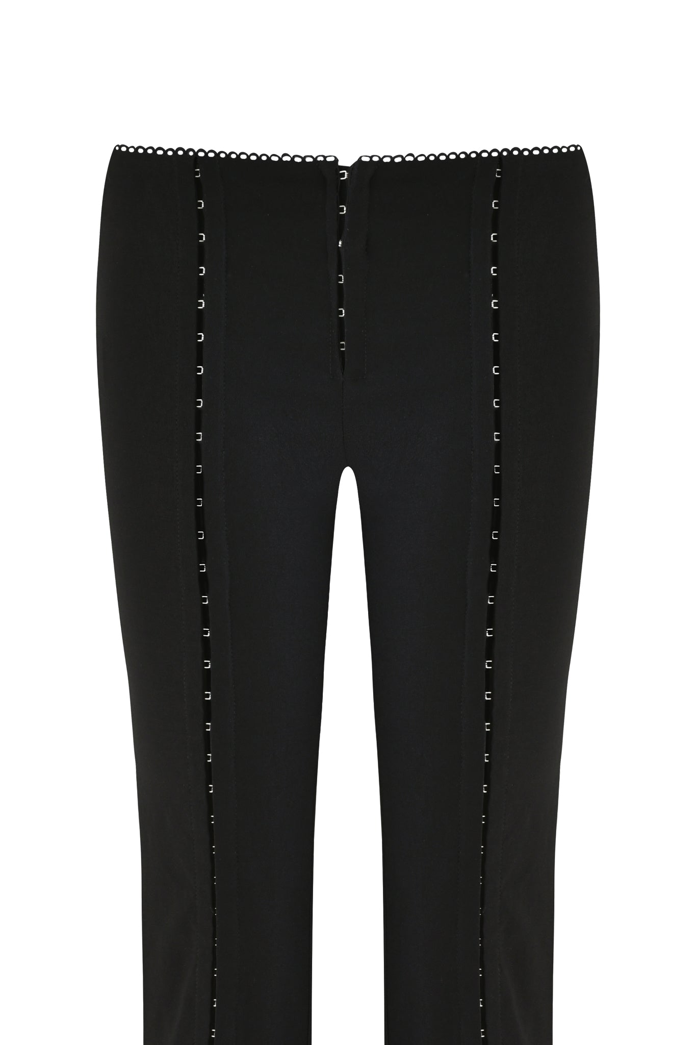The RONAN PANT - BLACK by I.AM.GIA features decorative vertical stitching and square embellishments on stretch woven fabric. These sleek pants have a small scalloped waistband and a subtle hook and eye detail, with a plain white background.