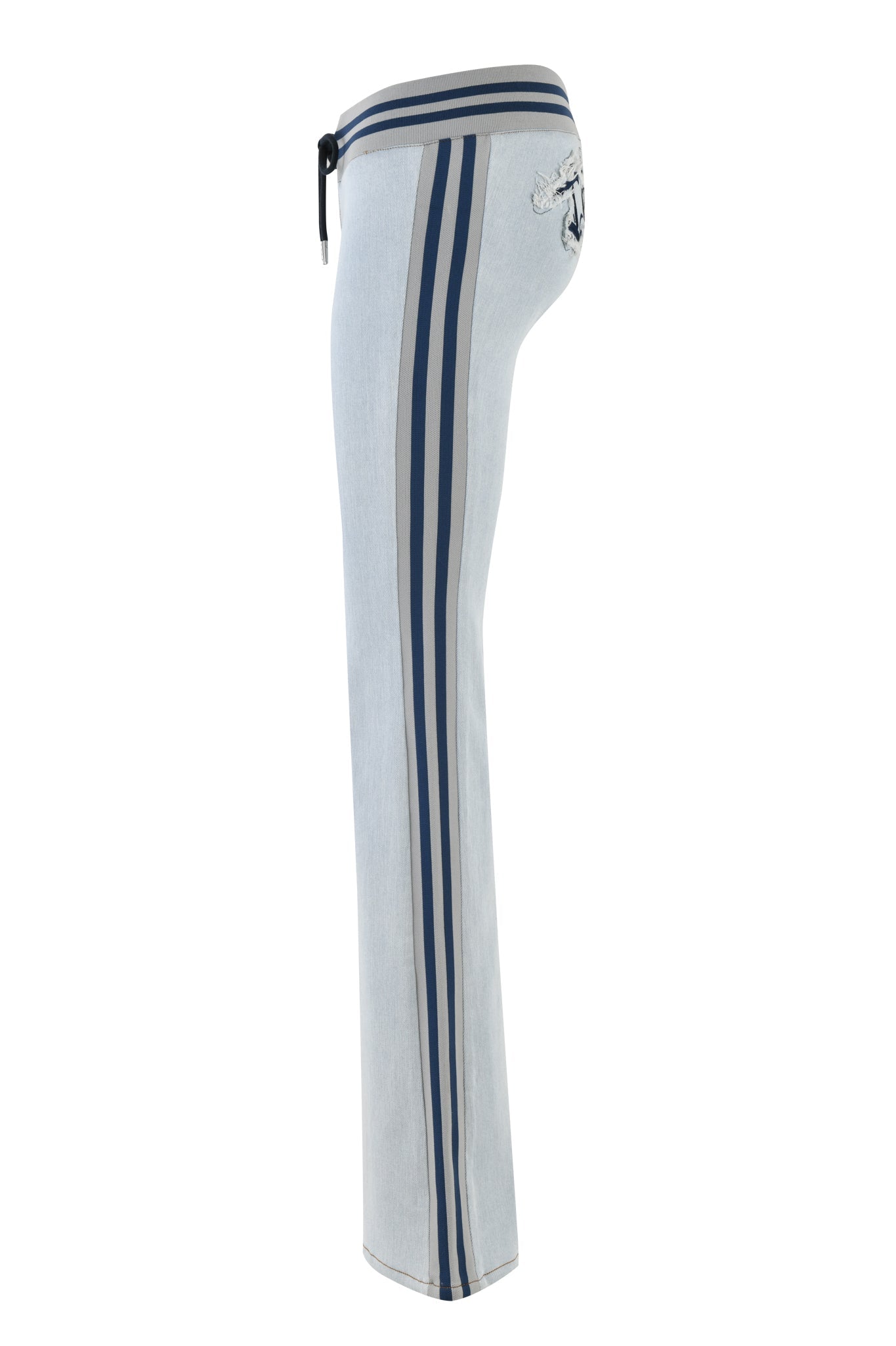 The LENNOX JEAN - BLUE by I.AM.GIA features a sleek side view with a light blue denim look and dark blue stripes. It boasts a drawstring waist, embroidered back pocket design, and offers a chic modern twist reminiscent of flared pants.