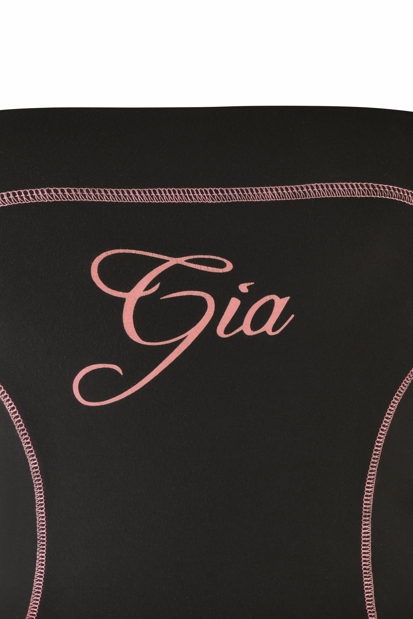 Close-up of the BLARE BOOB TUBE in black by I.AM.GIA, featuring decorative pink stitching and “Gia” embroidered in pink cursive across the center, showcasing this sporty crop top’s distinctive style.