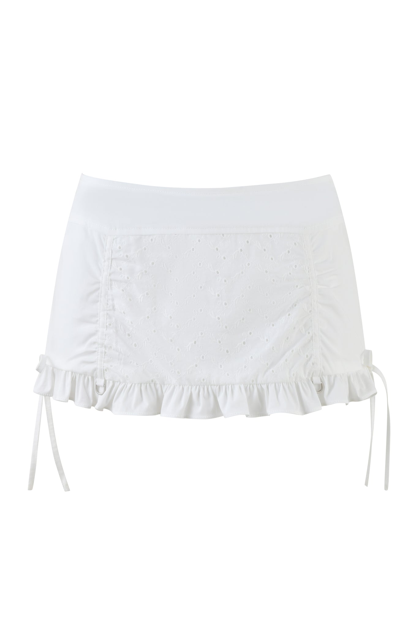 The WREN MINI SKIRT by I.AM.GIA is white, with side ruching and front eyelet embroidery, highlighted by a ruffle trim. It includes adjustable side ties for a customized fit and features an opaque, smooth fabric ideal for casual wear.