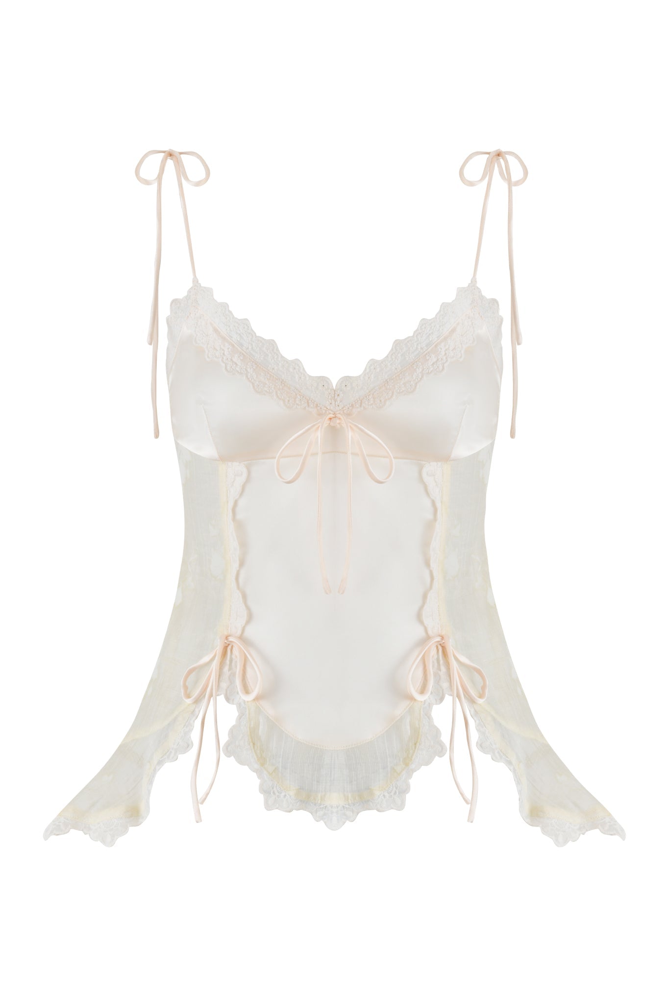 The MEADOW TOP - WHITE: FLORAL DELIGHT by I.AM.GIA features a sheer design with delicate lace trims in cream. It has thin straps tied in bows at the shoulders, a central bow at the neckline, and bows on the sides, all contributing to its elegant and feminine appeal.