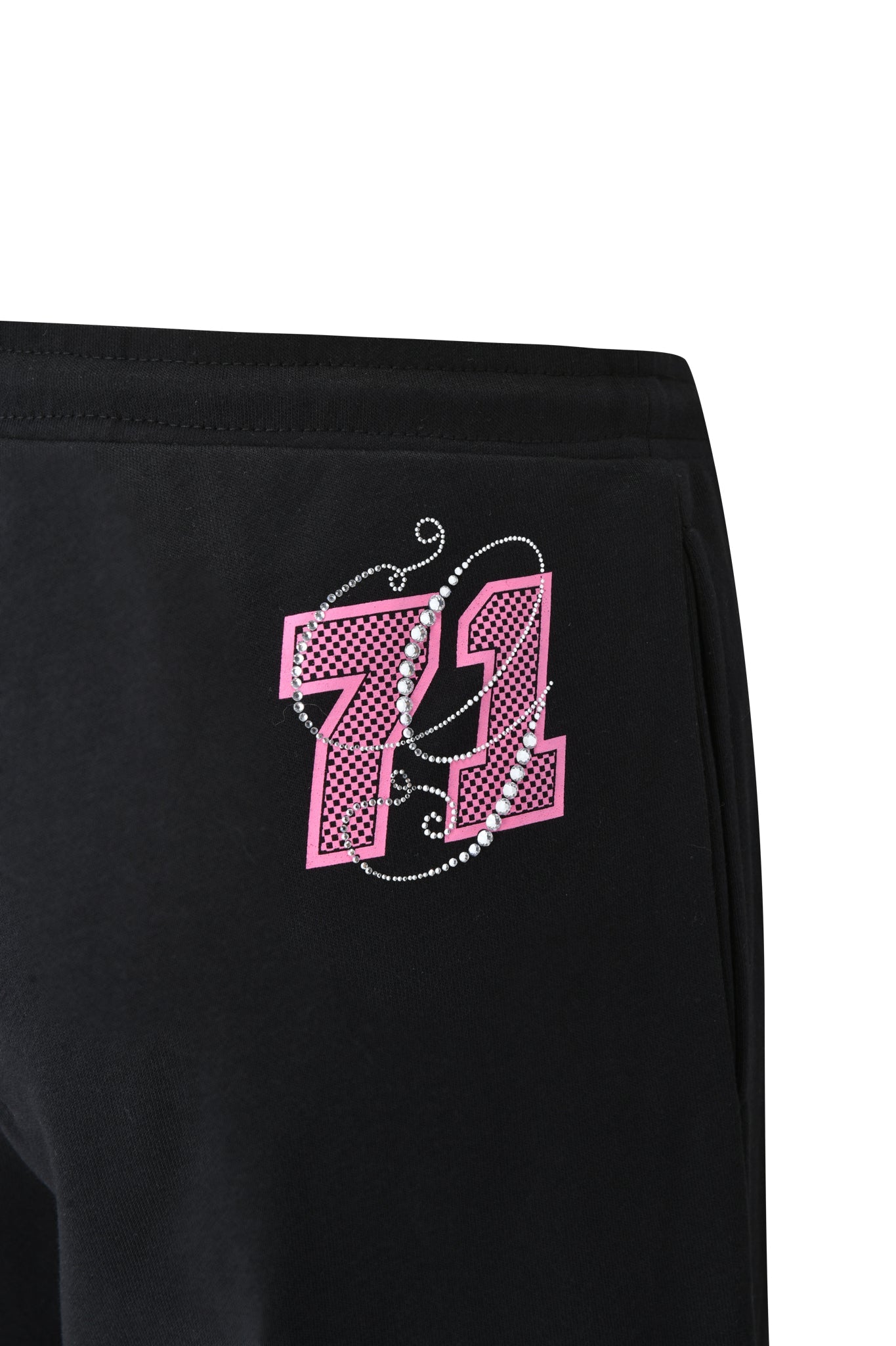 Close-up of the I.AM.GIA ARLO TRACK PANT - BLACK, a low rise baggy style with a pink and white "71" graphic and sparkling dot accents on the hip, displayed against a plain white background.