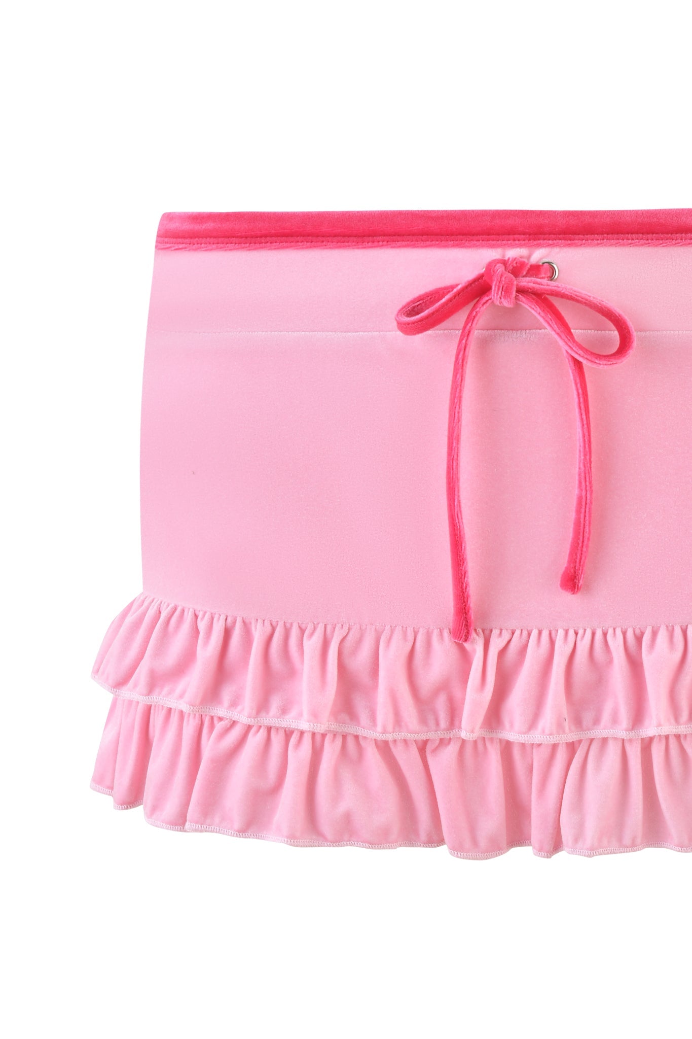 The MICHELLE VELOUR MINI SKORT by I.AM.GIA is a playful and feminine pink outfit featuring a decorative bow at the waistband and two ruffled layers at the hem.