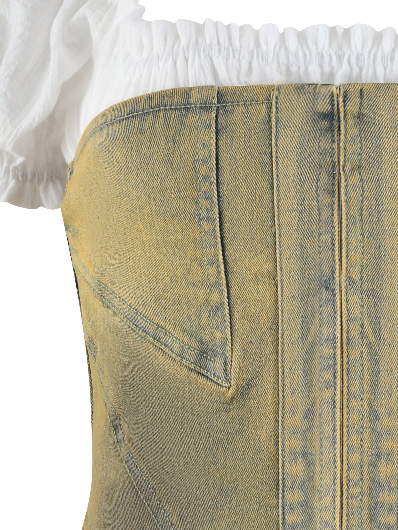 The JOSLIN TWO PIECE CORSET by I.AM.GIA features a sleeveless top with a beige denim corset design, frilled white fabric at the neckline, and a bodycon fit. The tan wash denim showcases visible seams and a slightly worn texture.