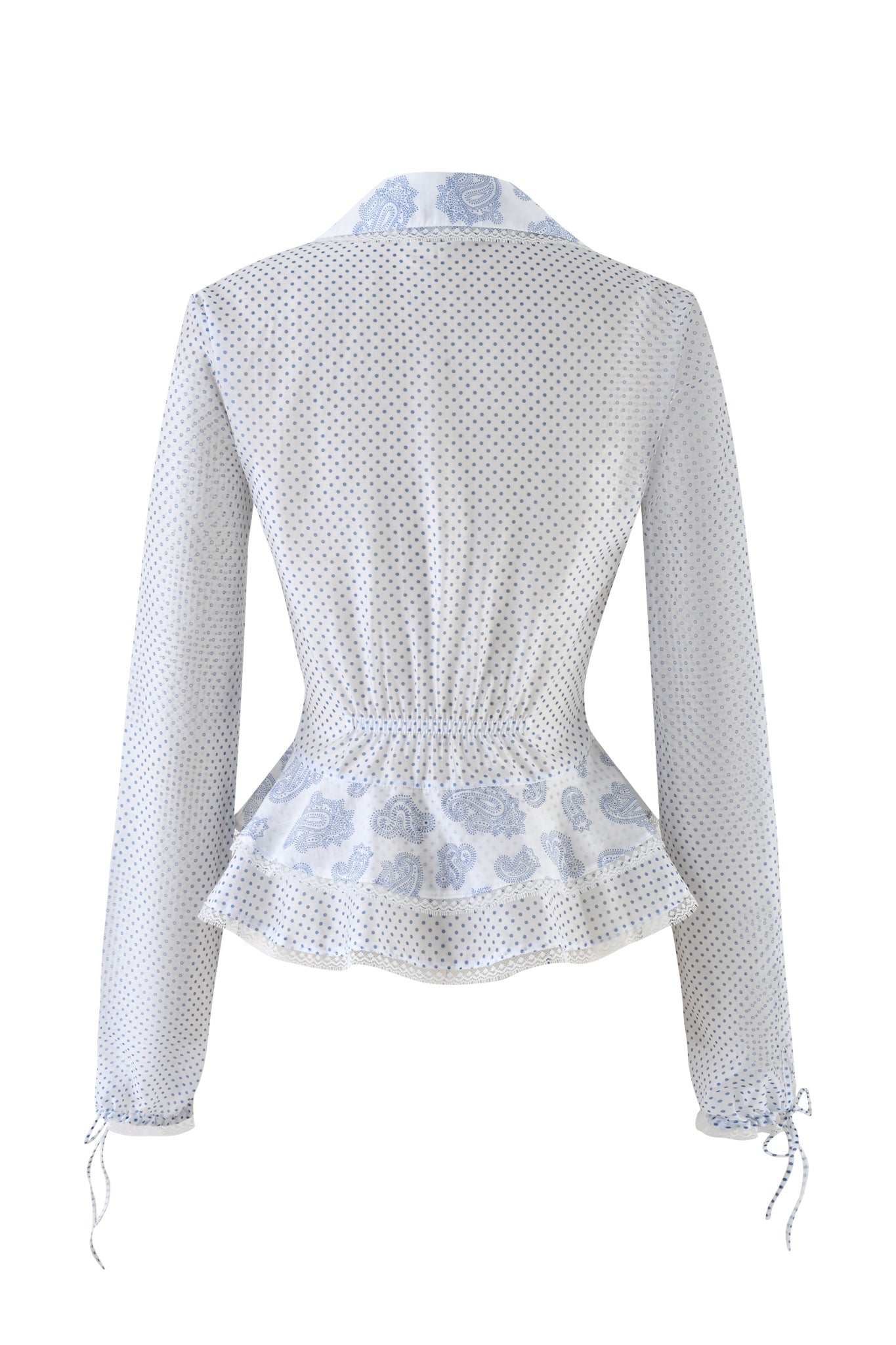 The OPAL TOP - WHITE by I.AM.GIA features a blend of blue polka dots and floral patterns, showcasing a peplum hem, elasticated waist, and long sleeves with cuff ties. The collar is designed with contrasting floral prints for added style.