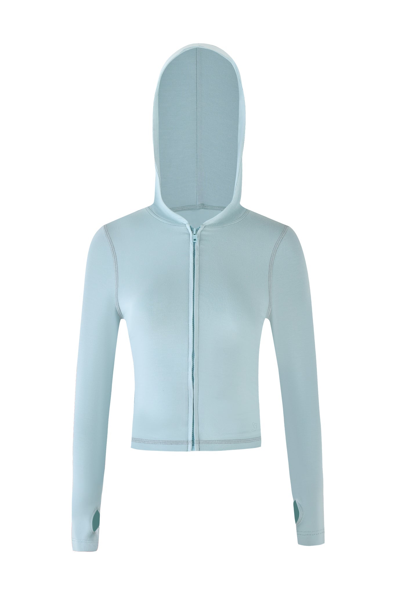 The I.AM.GIA Blare Hoodie in seafoam is a women's light blue cropped jacket with long sleeves featuring thumb holes and a front zipper. It's crafted from soft bamboo fabric and displayed on a plain white background.
