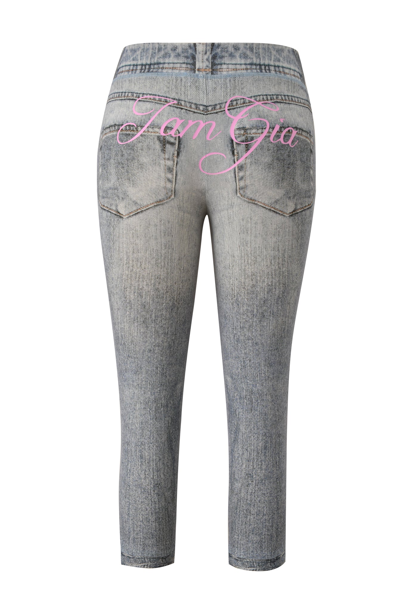 The BLARE CAPRI - DENIM TROMPE L'OEIL by I.AM.GIA is shown from the back with pink "I.AM.GIA" script across the pockets—a light-wash, cropped style ideal for a bold faux-denim capri look.