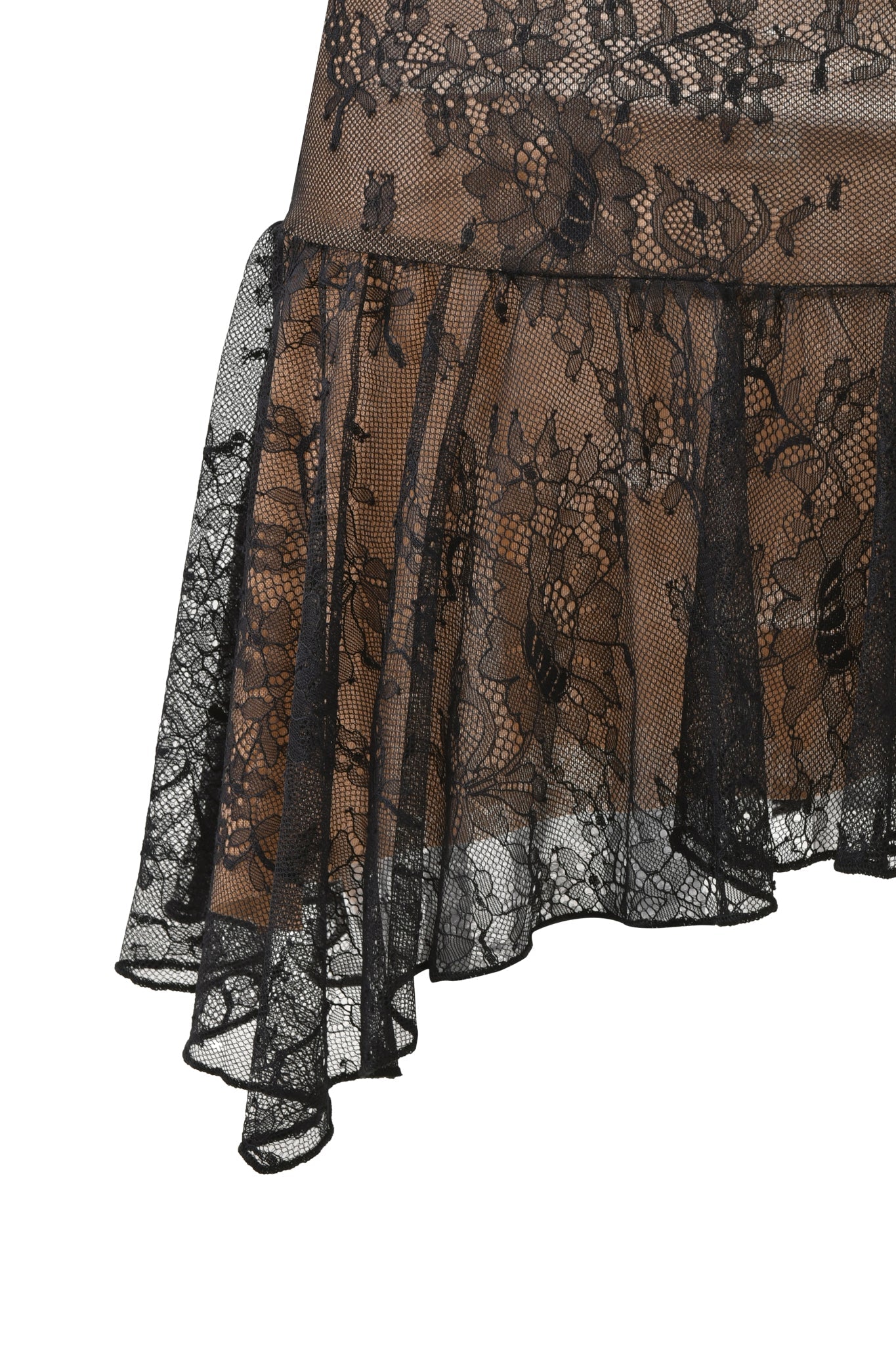 Close-up of the STEVIE SKIRT - BLACK by I.AM.GIA, featuring sheer black floral lace draped in layers with an asymmetrical hemline over a nude background.