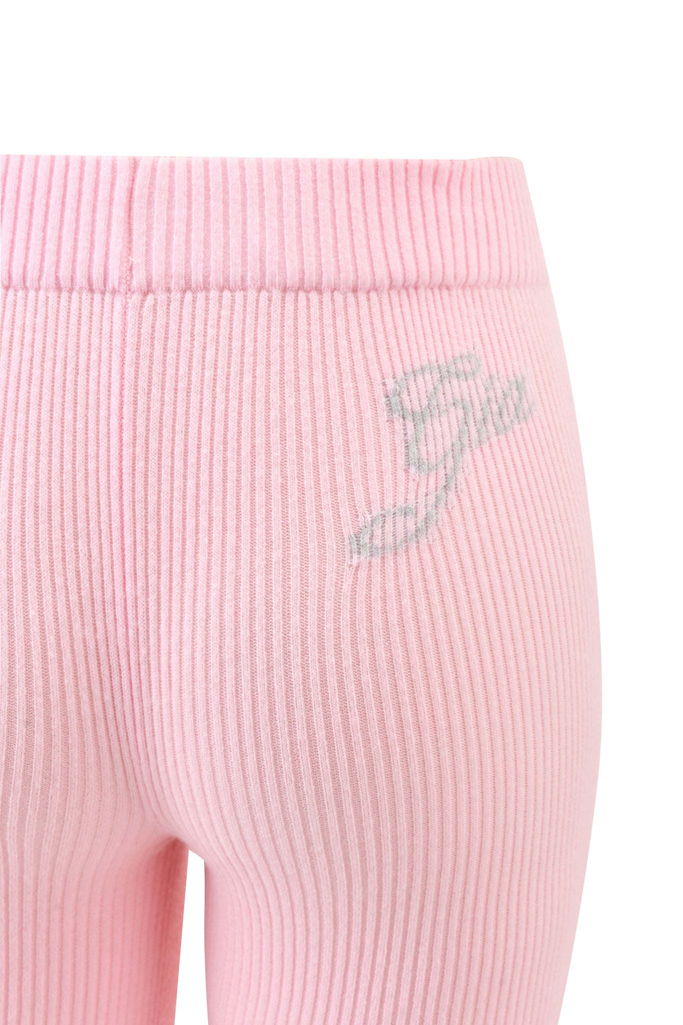Close-up of I.AM.GIA BLARE KNIT TRACKPANT in light pink ribbed fabric, featuring a silver embroidered logo on the upper hip.