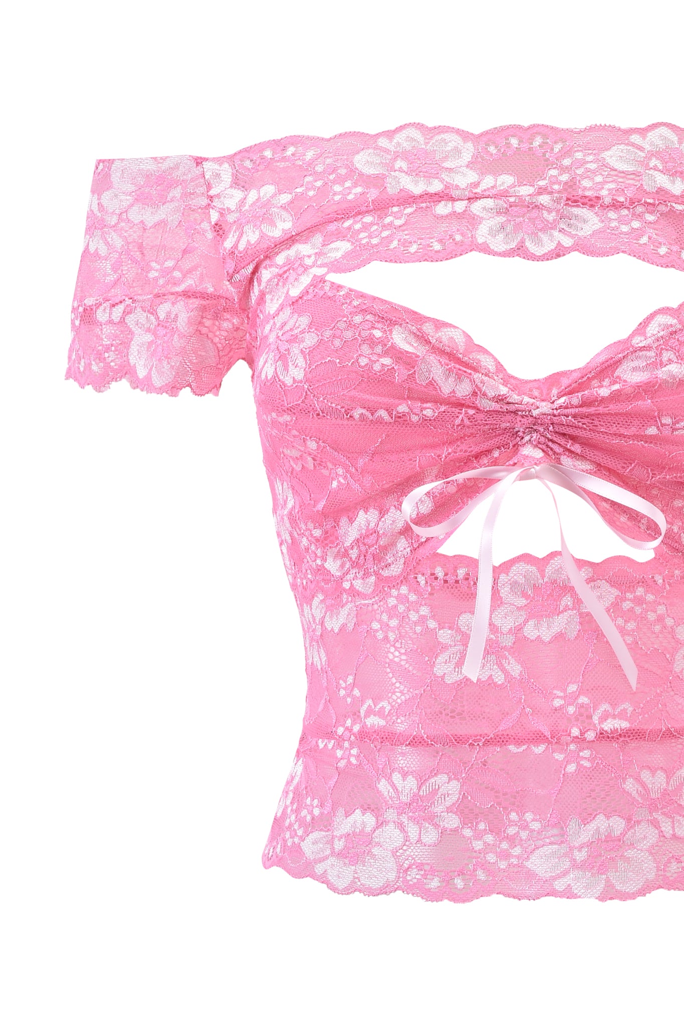 The CRYSTAL TOP - PINK by I.AM.GIA is a pink off-shoulder crop top in stretch lace with floral patterns, front cutout, and a white ribbon bow at the bust.