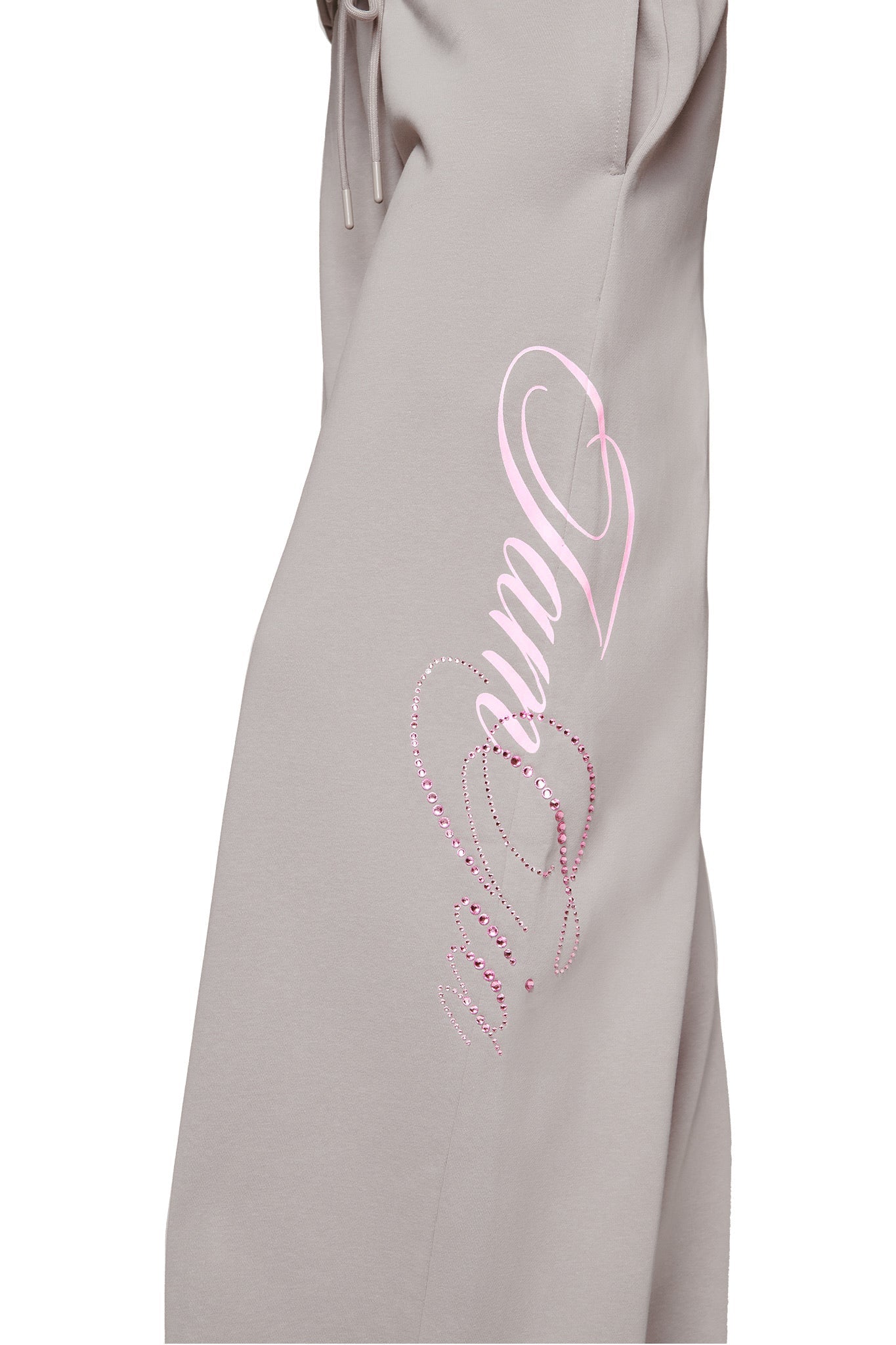 The I.AM.GIA KADE PANT - GREY is a wide leg sweatpant with "amour" in pink script, a heart outline, and decorative pink rhinestones along the side.