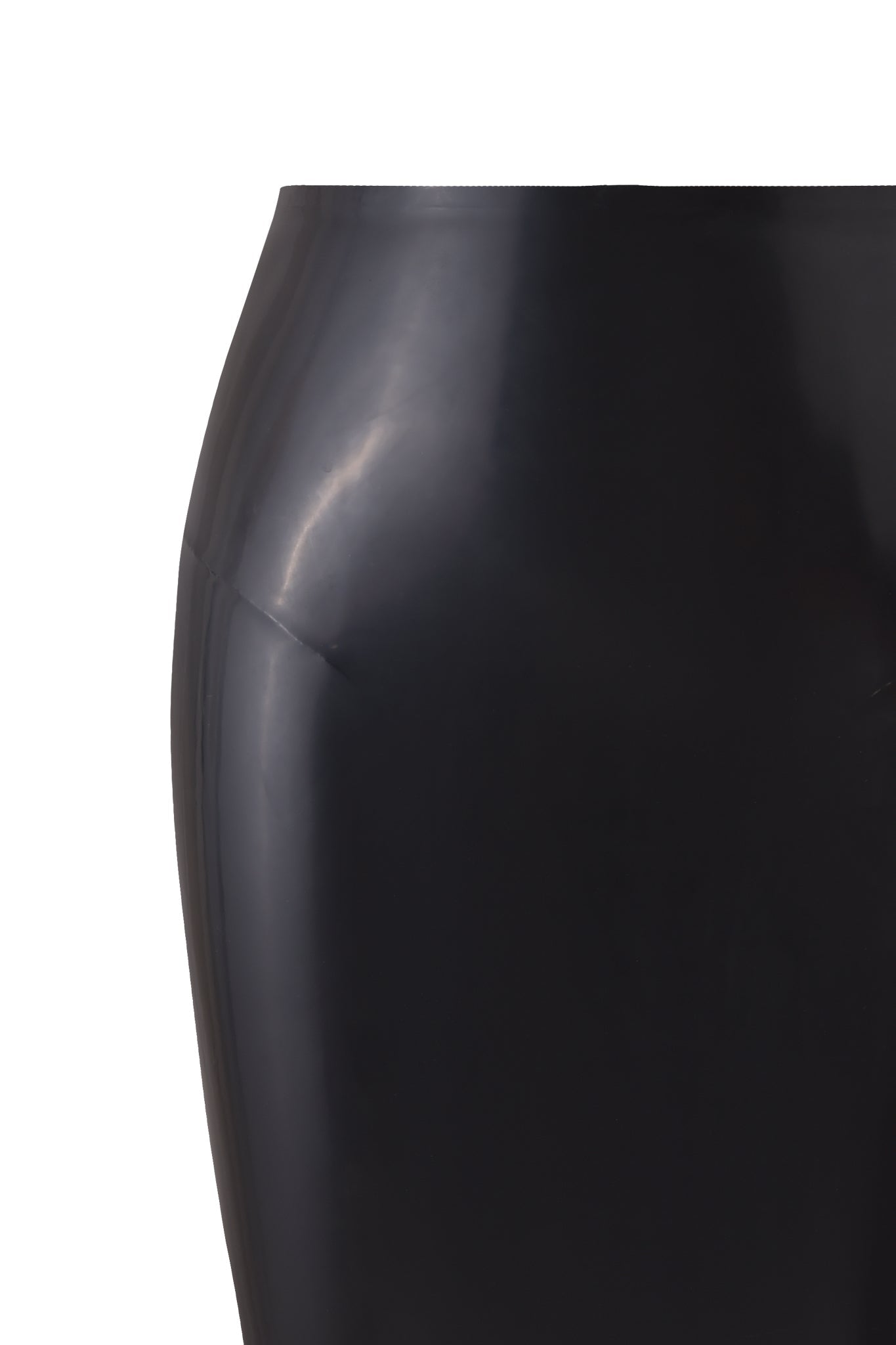 A close-up of the BUFFY LATEX MIDI SKIRT - BLACK by I.AM.GIA, showcasing its high gloss finish and shiny waist and hips against a plain white background.