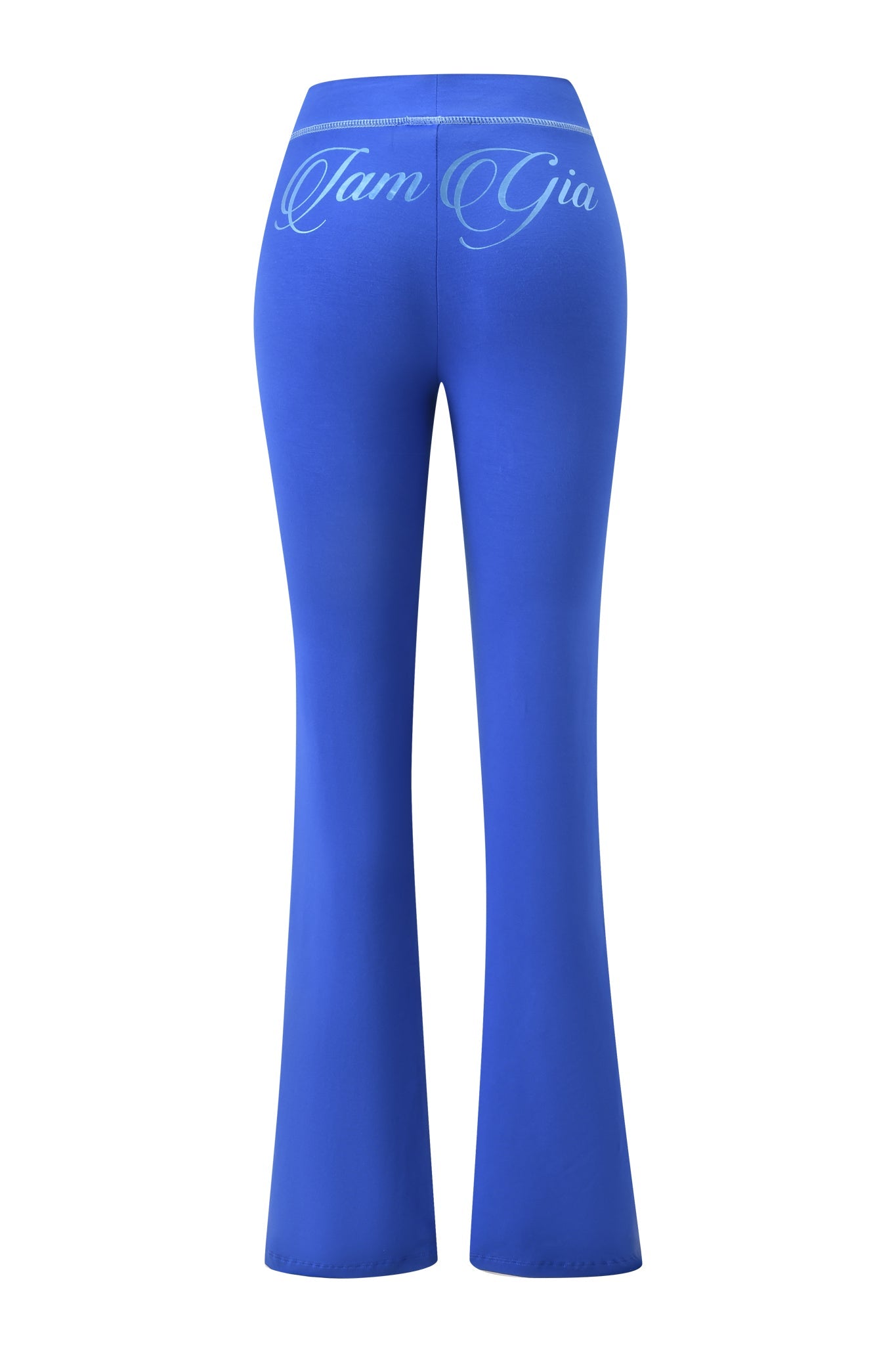 Back view of the BLARE FORM POCKET TRACKPANT - COBALT FOIL by I.AM.GIA, made from sculpted Form fabric with "I.AM.GIA" in cursive across the waistband.