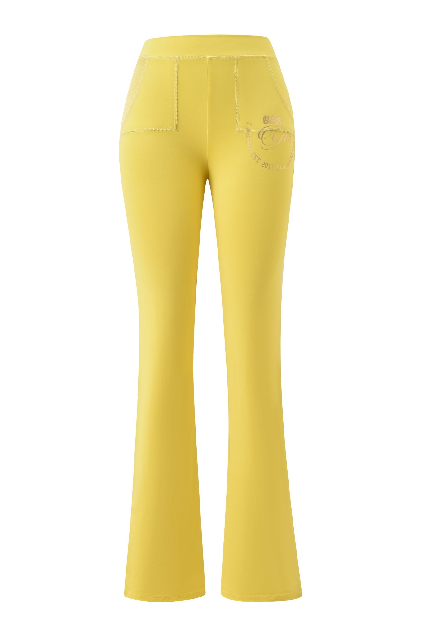 The I.AM.GIA BLARE FORM POCKET TRACKPANT - YELLOW GOLD FOIL features a high waist, front patch pockets, and a subtle logo on the left hip, crafted from sculpted Form fabric in yellow. Shown against a white background.