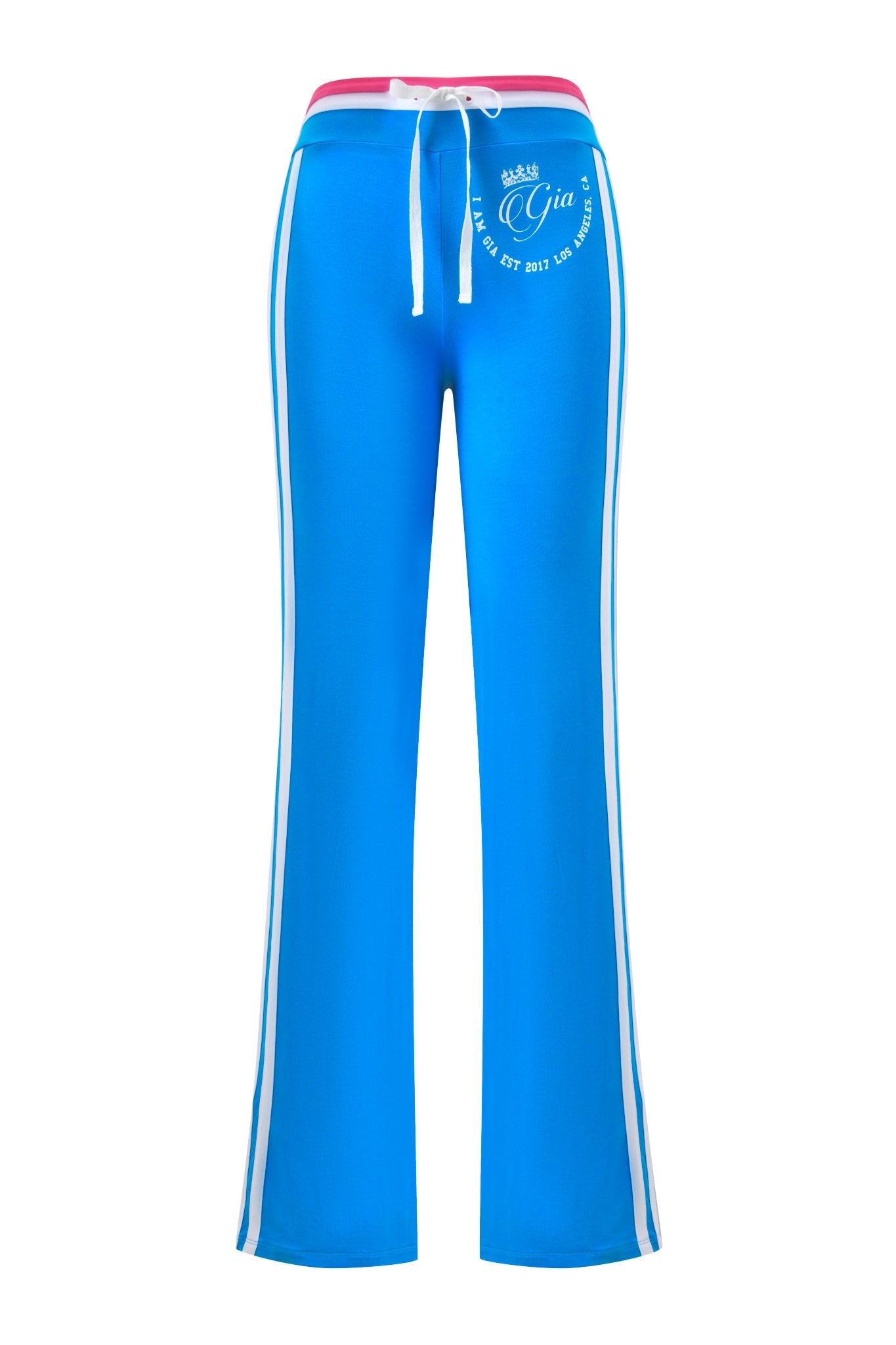 The BLARE STRIPED TRACKPANT - SKY BLUE by I.AM.GIA features a low-rise waist, white side stripes, a pink waistband detail, and white printed text near the left hip for a sporty, stylish vibe.