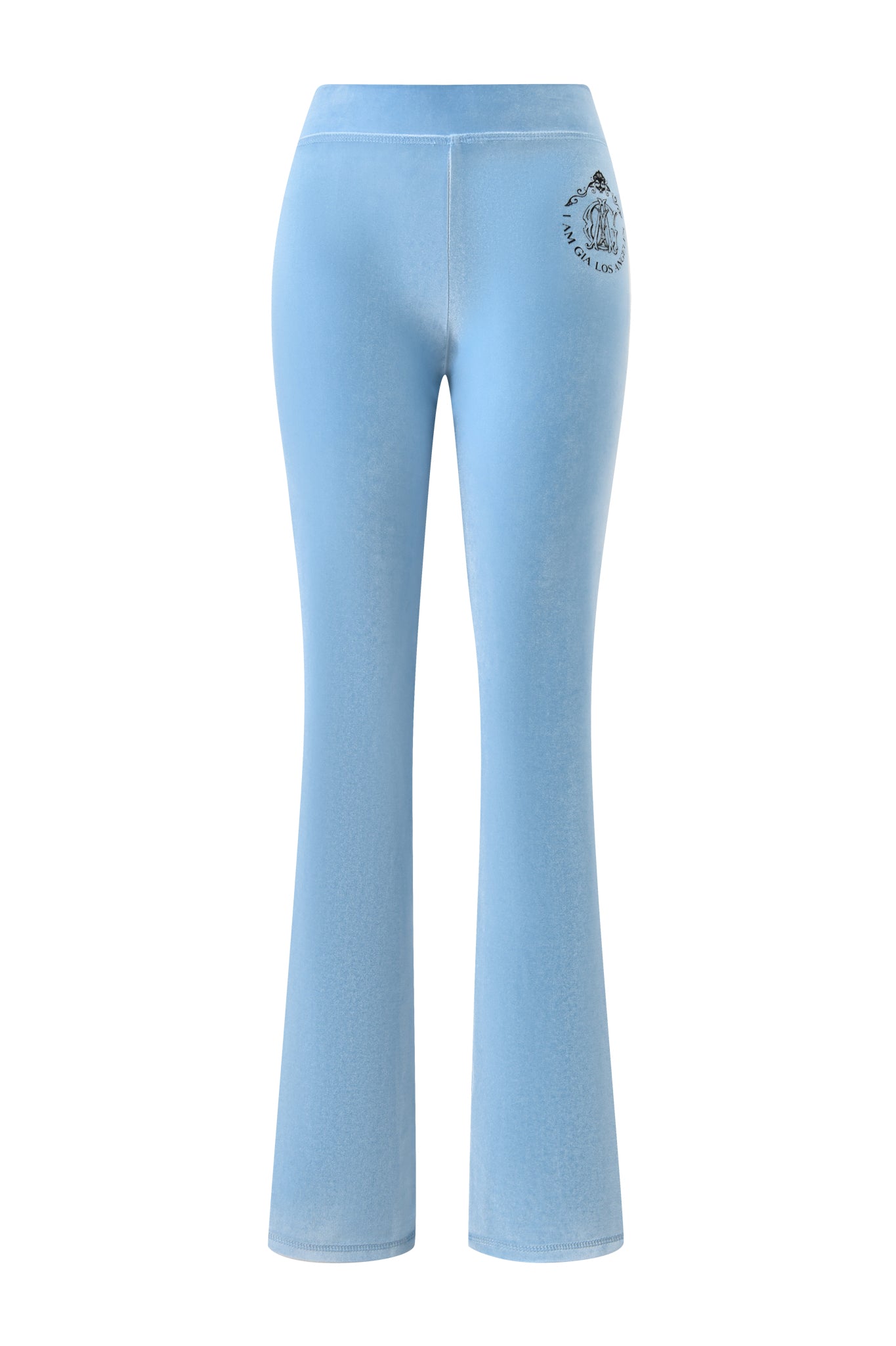 The I.AM.GIA BLARE VELOUR POCKET TRACKPANT in ice blue features a mid-rise waist, flared leg, and a small black circular GIA script logo on the upper left back near the waistband.