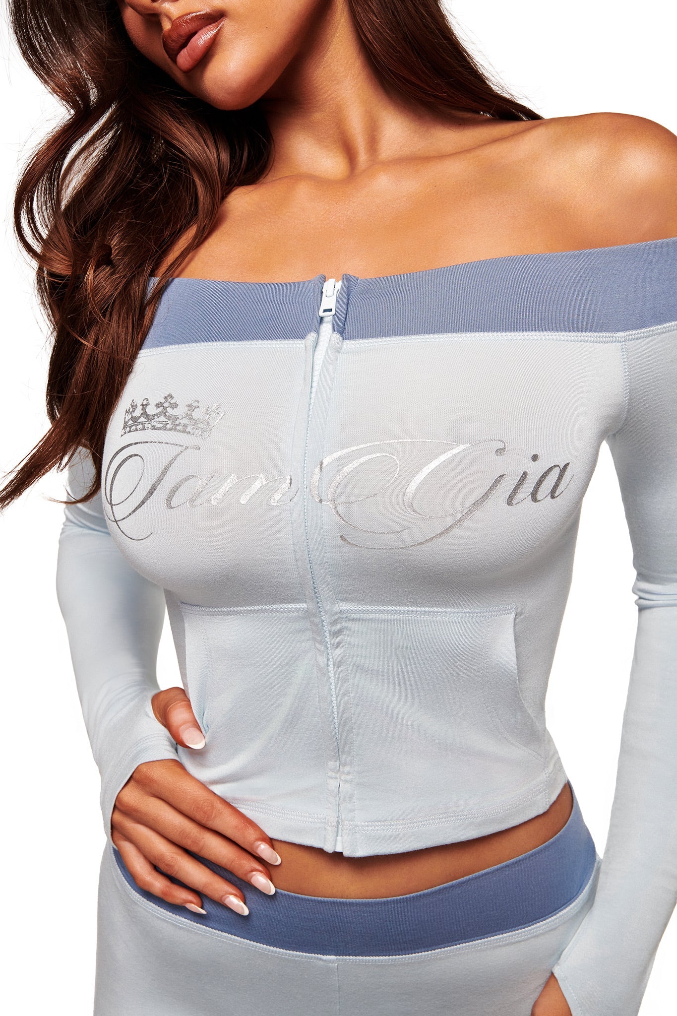 A woman wearing the I.AM.GIA BLARE OFF SHOULDER TOP in two tone powder blue.