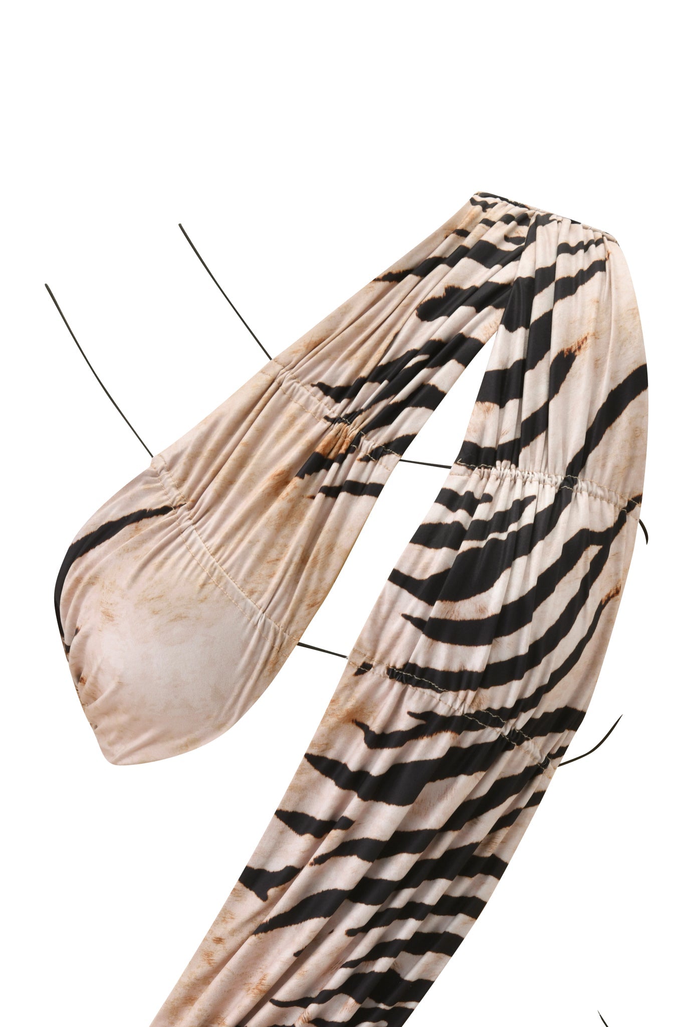 A close-up of a zebra-print bikini top with thin black straps and ruching—ideal for pairing with I.AM.GIA’s SASKIA MINI DRESS - WILD SIDE for a bold animal print look.