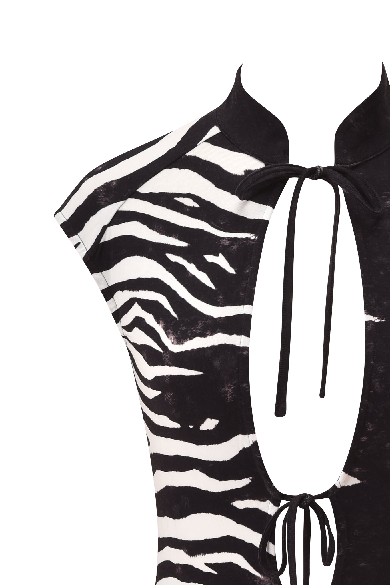 Close-up of the I.AM.GIA GEORGIA TOP - BLACK WILD SIDE, showcasing its zebra print, cap sleeves, high collar, and two front keyhole cutouts tied with black strings. No head or lower body visible.