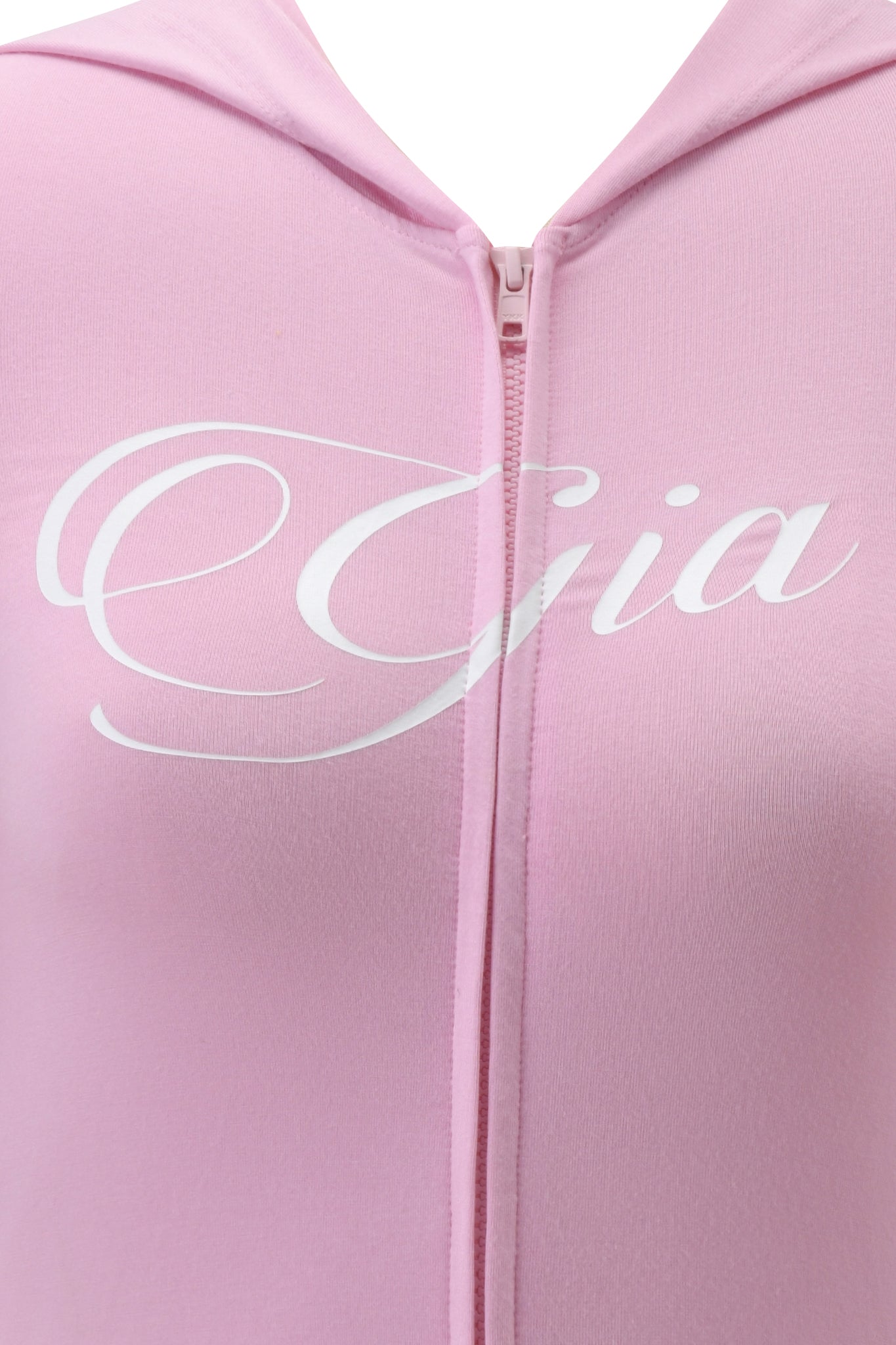 Close-up of the BLARE PIPING HOODIE in baby pink and white by I.AM.GIA, featuring partially visible white "Gia" script across the chest.