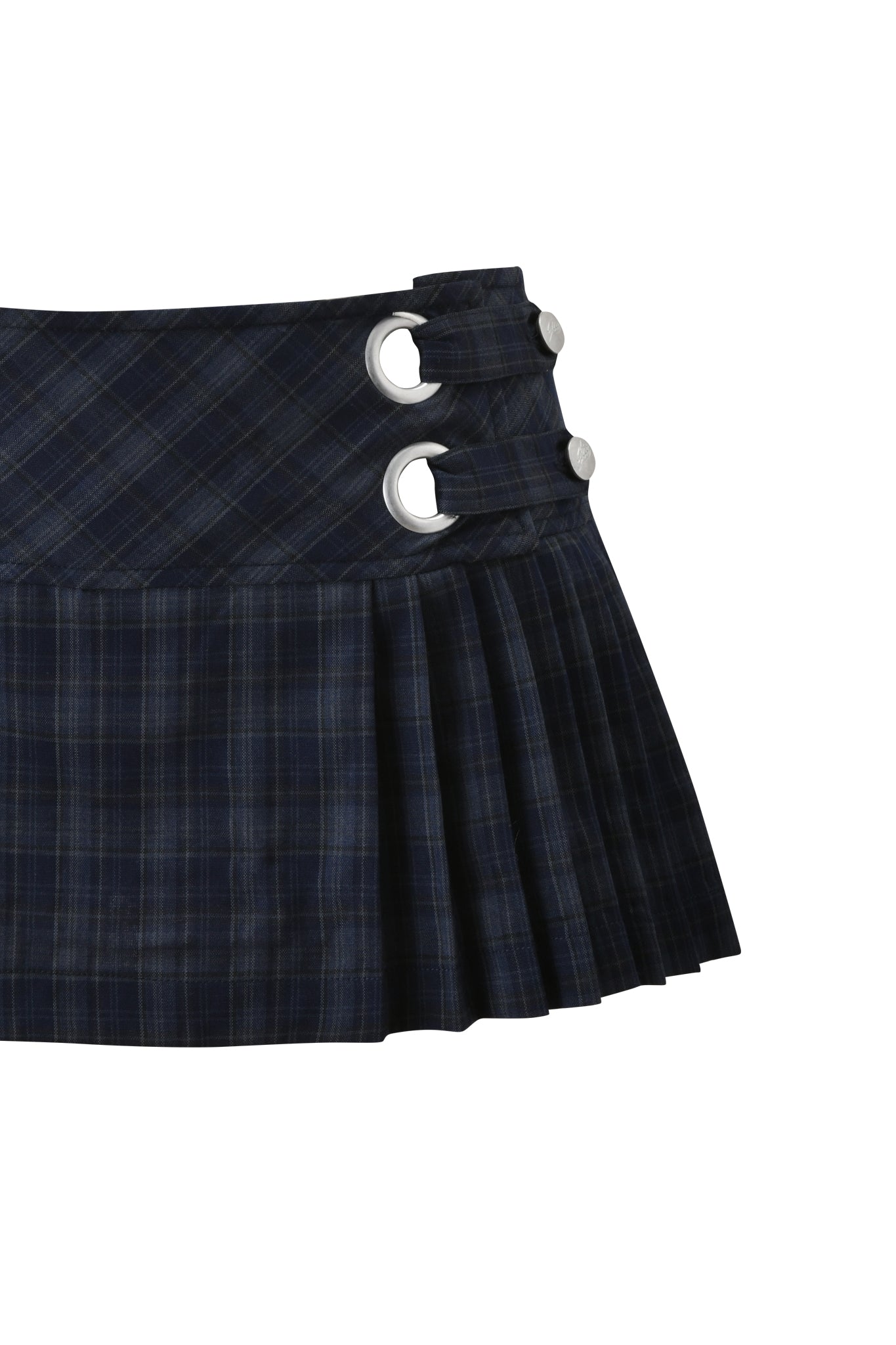 The I.AM.GIA ROUX MINI SKORT in blue plaid is a navy micro mini with black pleats, two large silver grommets, and buttons on the low rise waistband, shown close-up against a white background.