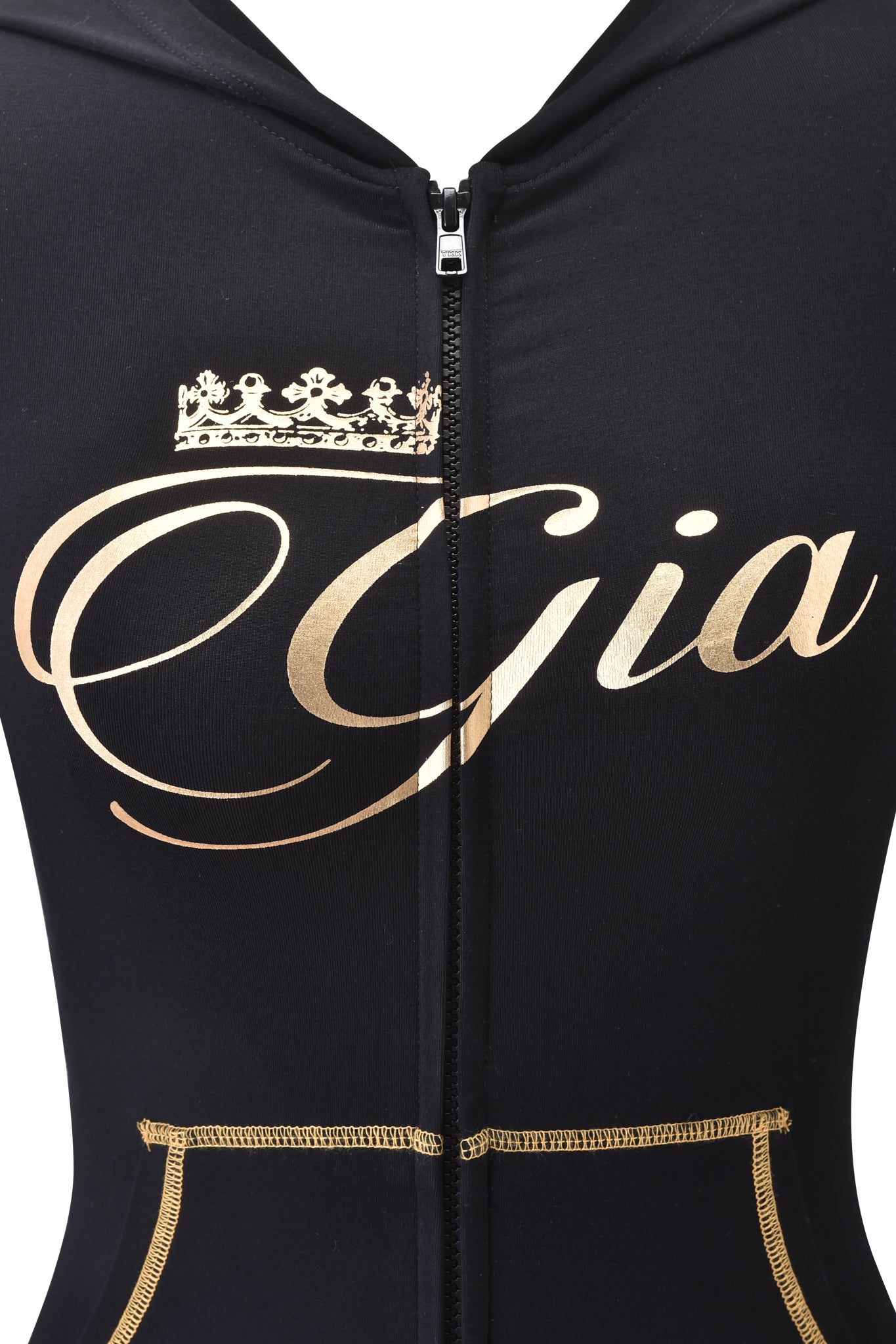 Close-up of the I.AM.GIA BLARE FORM MULTI POCKET HOODIE in black and gold, featuring bold "Gia" cursive lettering with a gold crown above the "G." This bamboo fabric hoodie offers a chic, bodycon fit and gold stitching for effortless style.