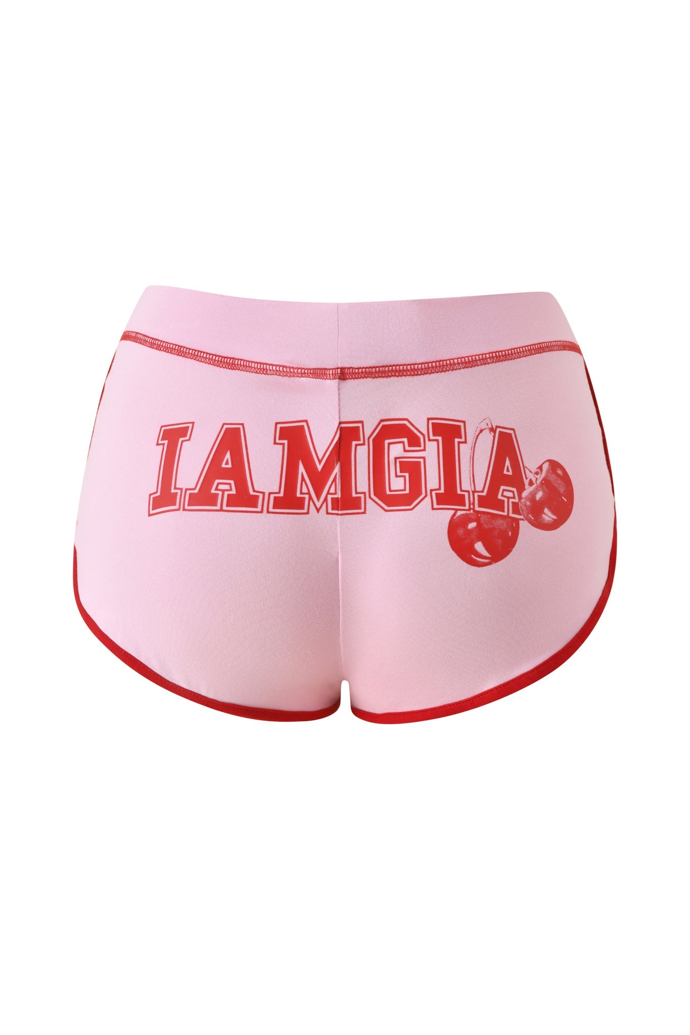 The BLARE DOLPHIN SHORT - BABY PINK by I.AM.GIA features a pink bamboo fabric with red trim, bold red "I AM GIA" lettering across the back, and a cherry graphic—perfectly on-trend mini shorts for stylish summer beachwear.