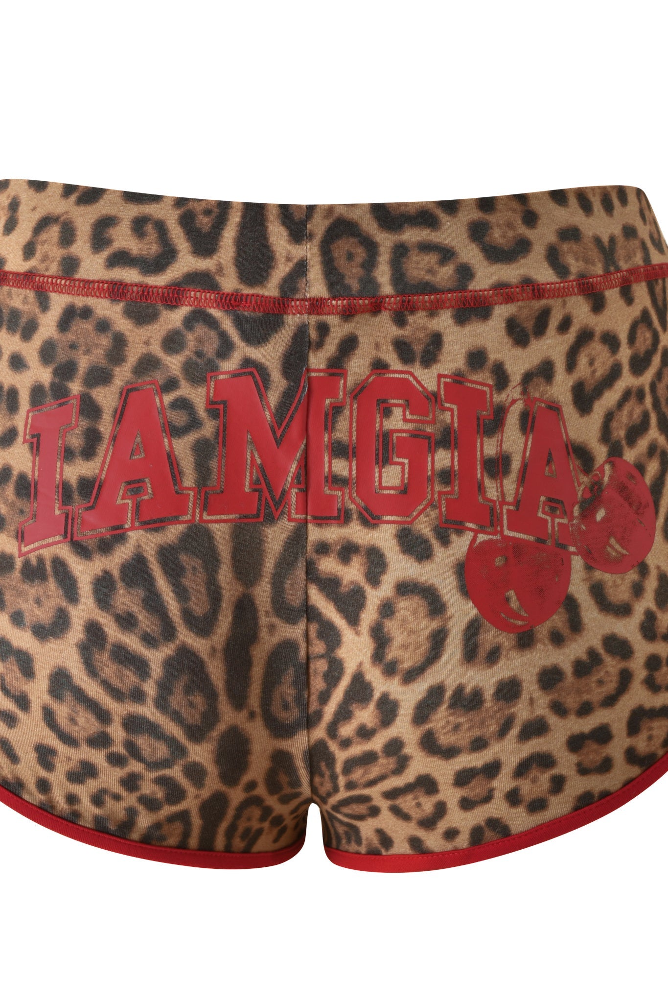 The BLARE DOLPHIN SHORT - PANTHERA by I.AM.GIA showcases a striking Panthera print with bold red "IAMGIA" lettering on the back and a playful red cherry graphic on the right side. These mini dolphin shorts are ideal for summer adventures, blending daring style with fun details for a standout look.