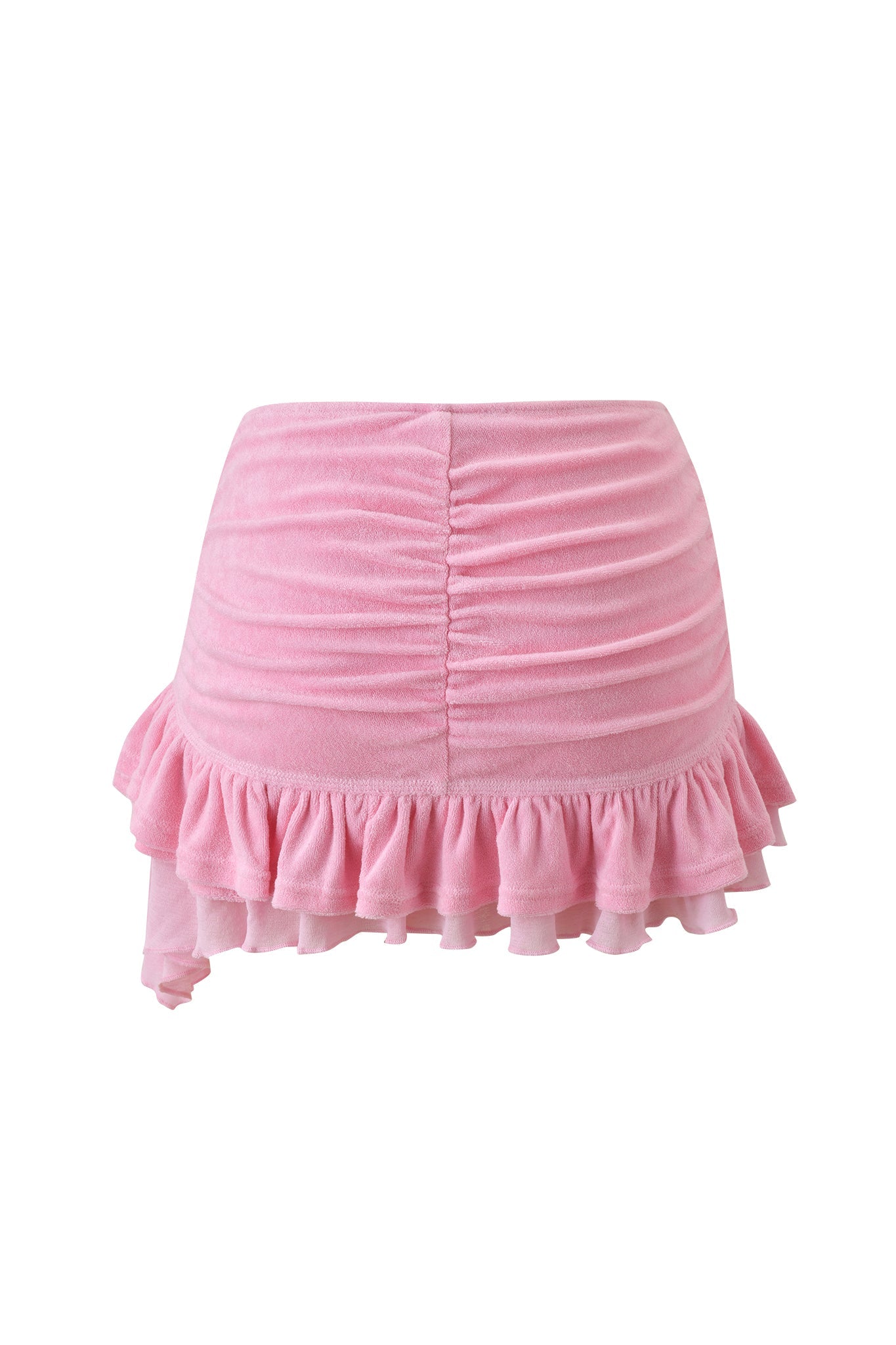 The BRIELLE TERRY MINI SKIRT - PINK by I.AM.GIA is a pink terry mini skirt with ruched detailing, an asymmetrical hem, and playful ruffled trim—perfect for a fun, flirty look.