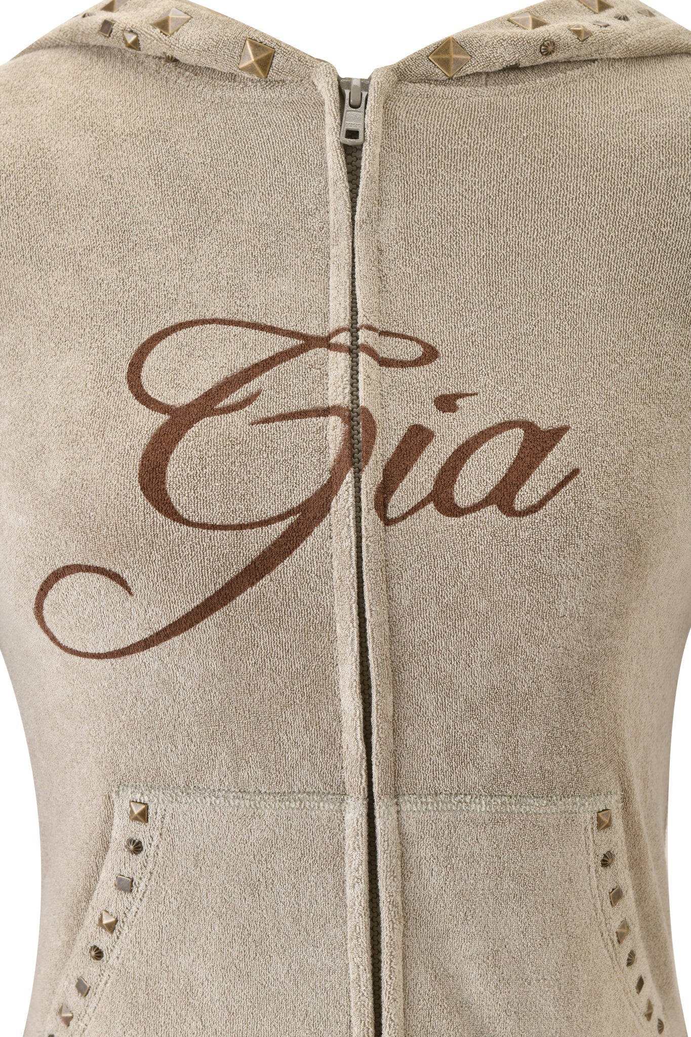 Close-up of the I.AM.GIA BLARE STUDDED TERRY HOODIE in Stone, featuring "Gia" in cursive on the front, metal studs along the hood and pocket edges, and two stylish front pockets.