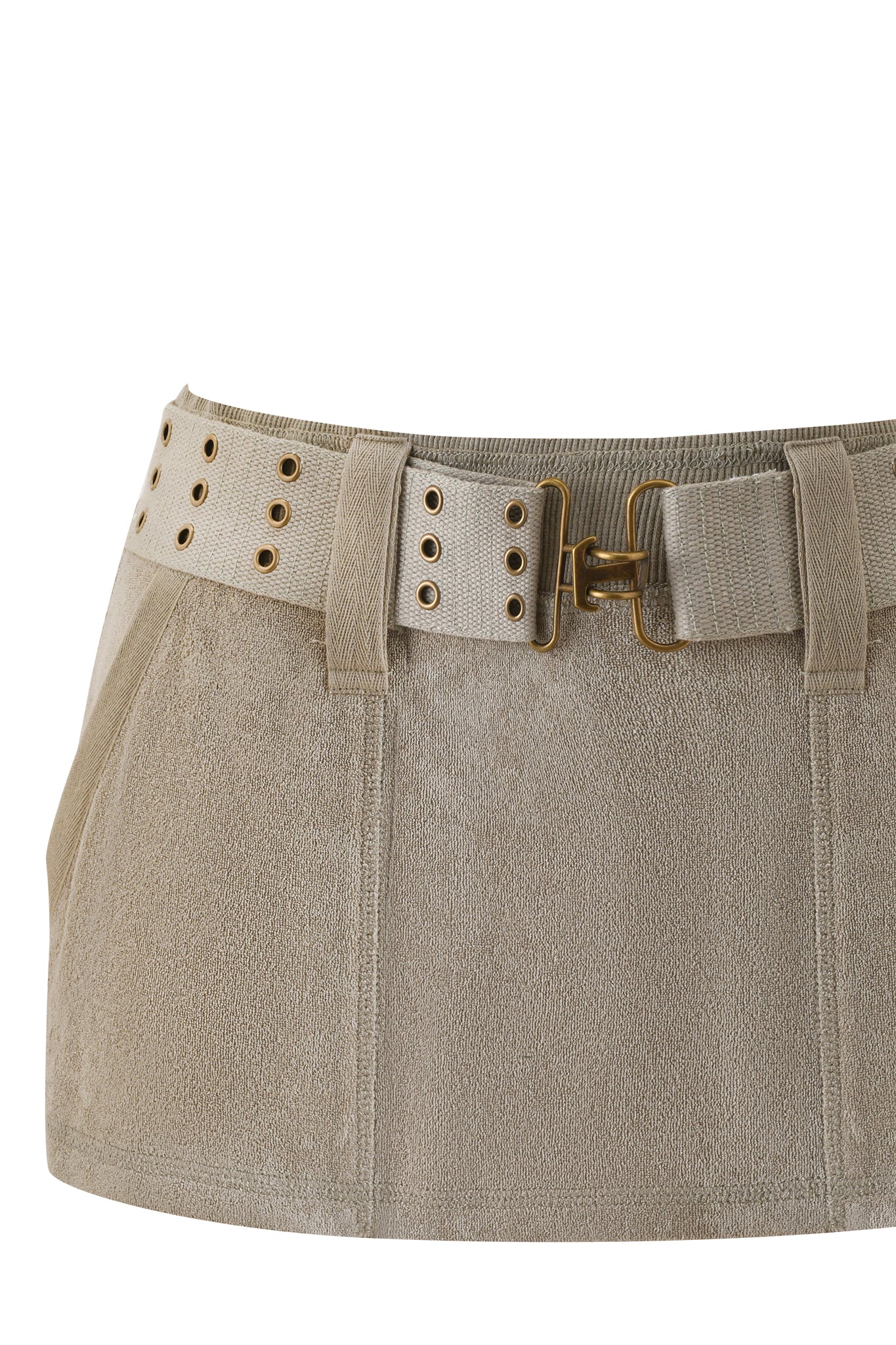 A close-up of the I.AM.GIA ISSHA TERRY MINI SKIRT in Stone, a beige suede low-rise mini skirt with side pockets and a matching belt featuring gold eyelets and a gold buckle.