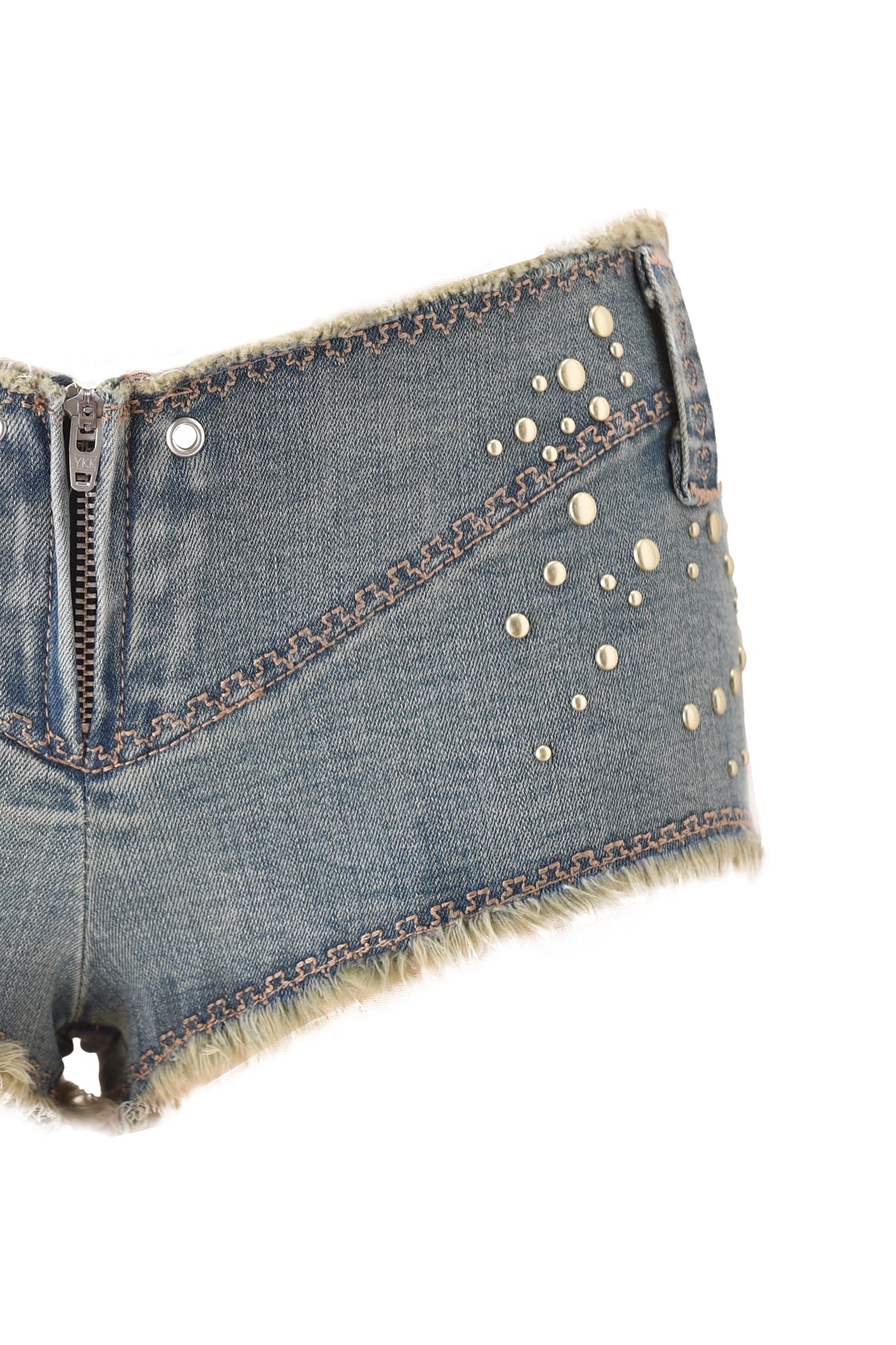 The I.AM.GIA VEXA SHORT in Vintage Blue Denim features an ultra low-rise fit, vintage wash, frayed edges, front zipper, decorative seams, gold stud pattern, and a distressed look.