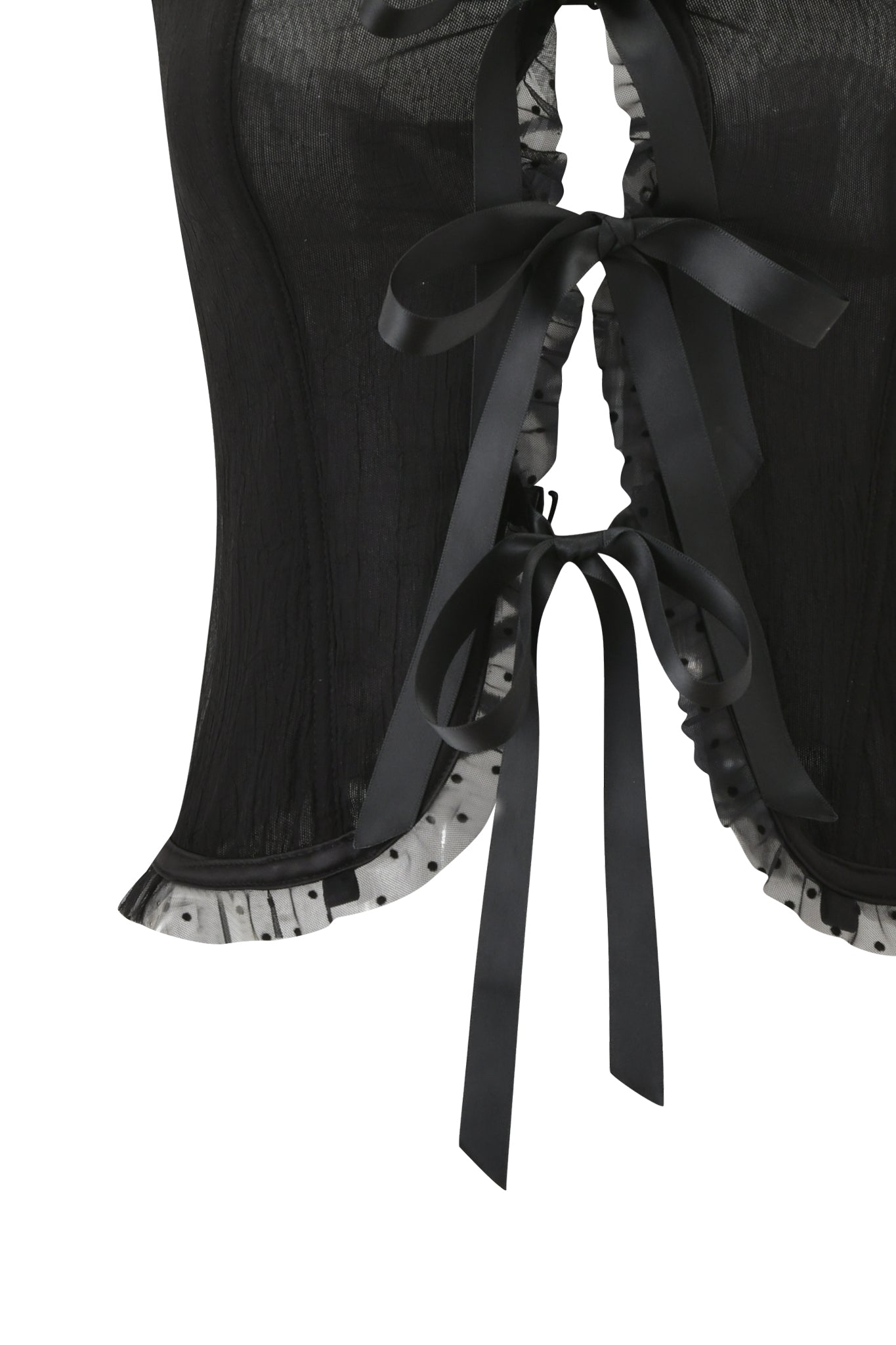 Close-up of the CIRA CORSET - BLACK by I.AM.GIA, a strapless sheer corset with polka dot ruffle, white ruffled trim, and two black satin ribbon bows tied at the back.