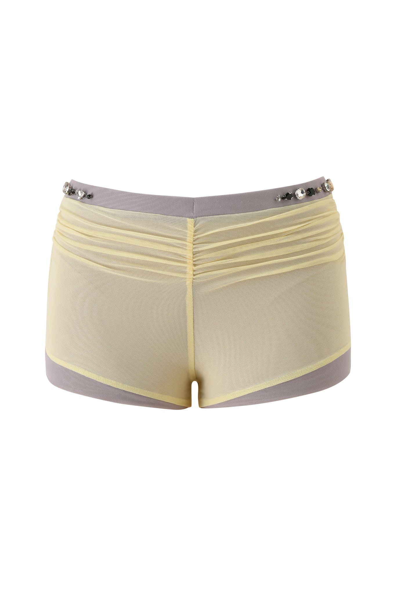 The AMATHA SHORT - BUTTER YELLOW by I.AM.GIA features sheer butter yellow mesh, a ruched back, gray low-rise waist, and silver studs along the top edge, displayed against a white background.