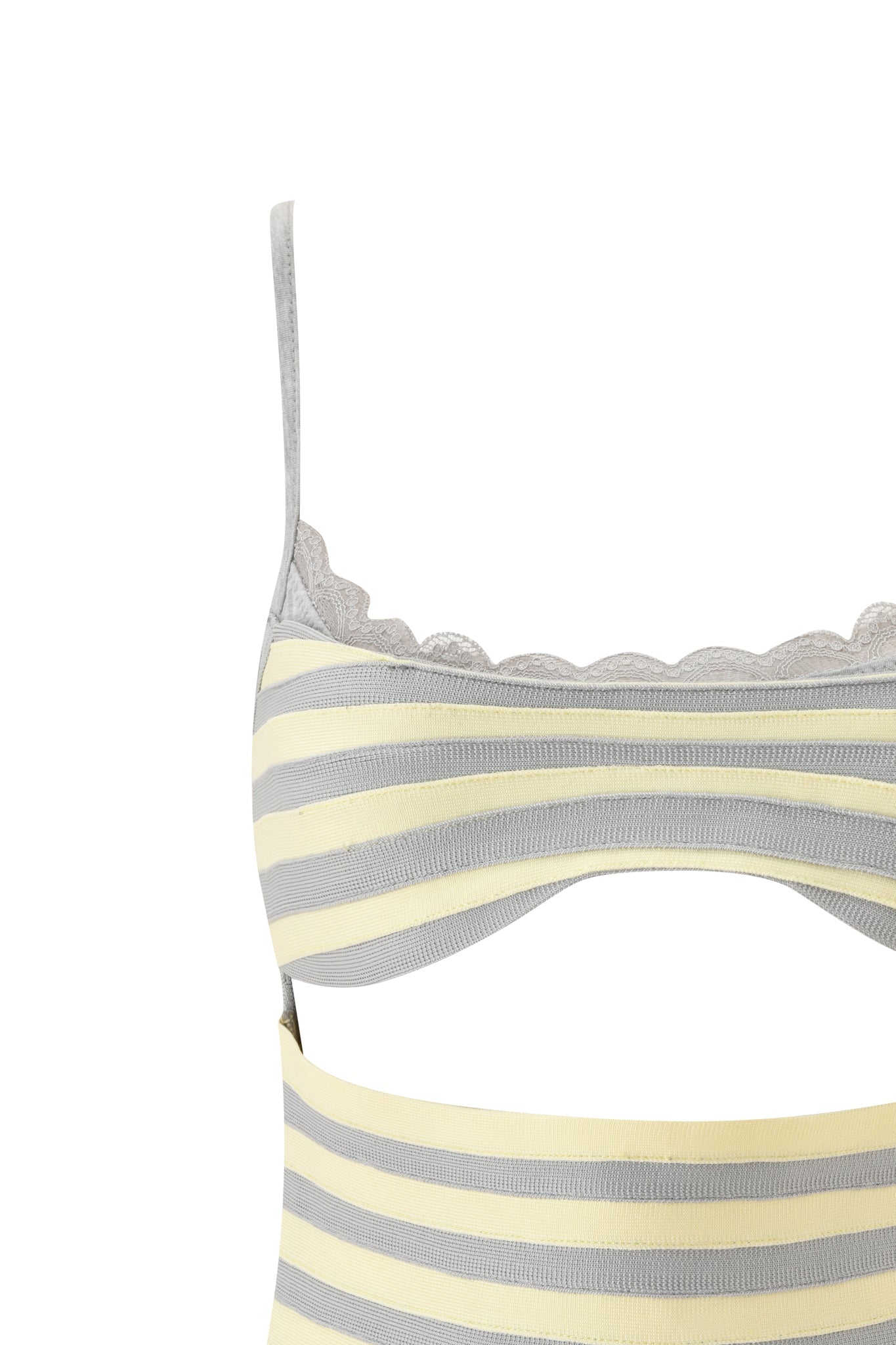 Close-up of the NYNA BANDAGE CAMI TOP in yellow by I.AM.GIA, featuring ribbed fabric and delicate scalloped lace trim along the top edge. Styled with high-waisted underwear in coordinating light yellow and gray stripes.
