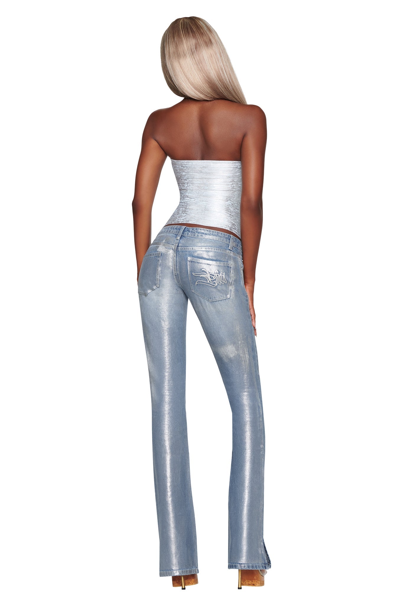 A person with long blonde hair stands with their back to the camera against a white background, wearing a silver strapless top, platform heels, and the RENATA JEAN - SILVER METALLIC WASH by I.AM.GIA.