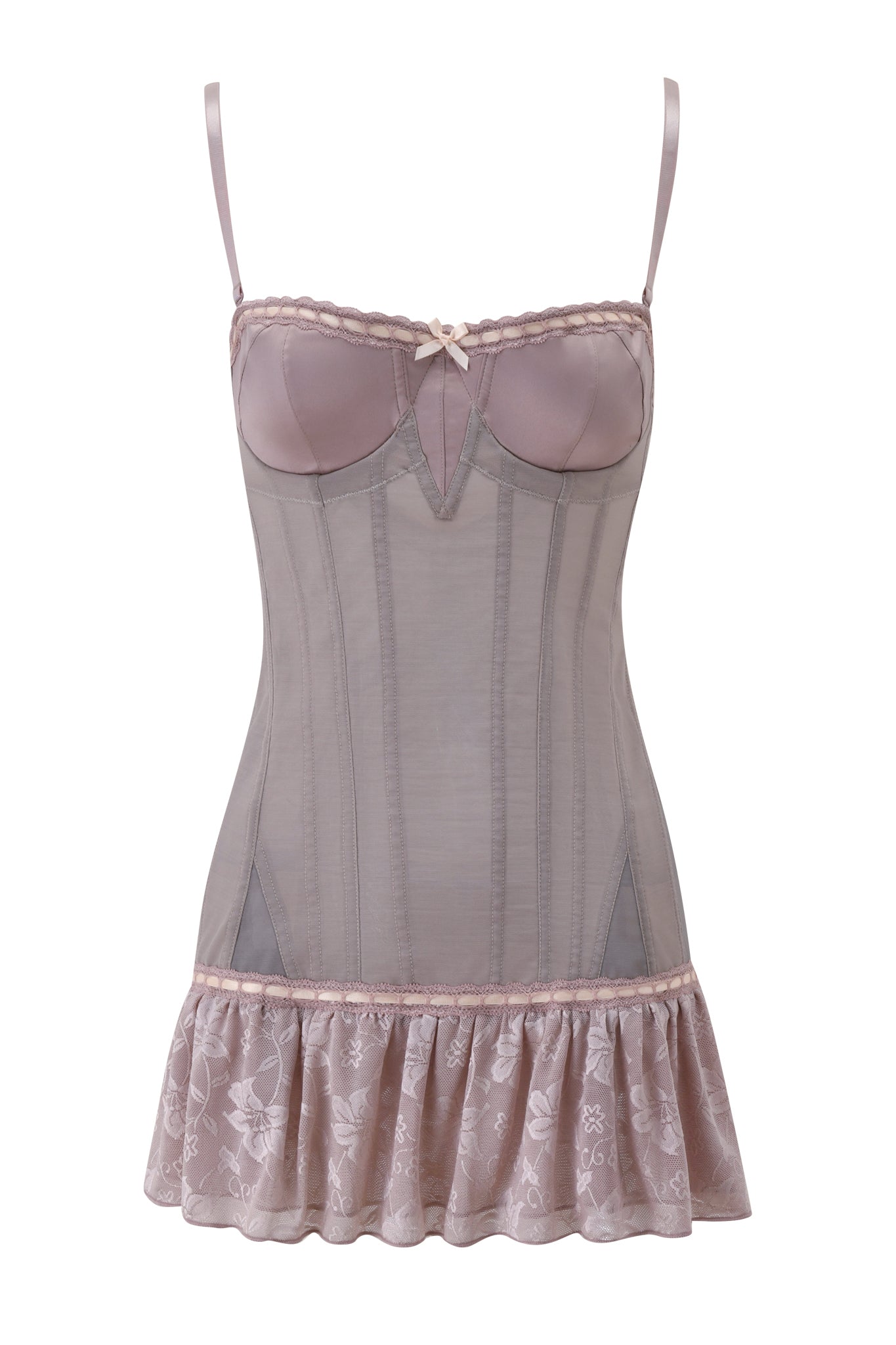 The ODETTE DRESS - DOVE by I.AM.GIA is a mauve sheer mesh slip dress featuring adjustable thin straps, a central bow, corset-style details, and a flared floral lace hem.