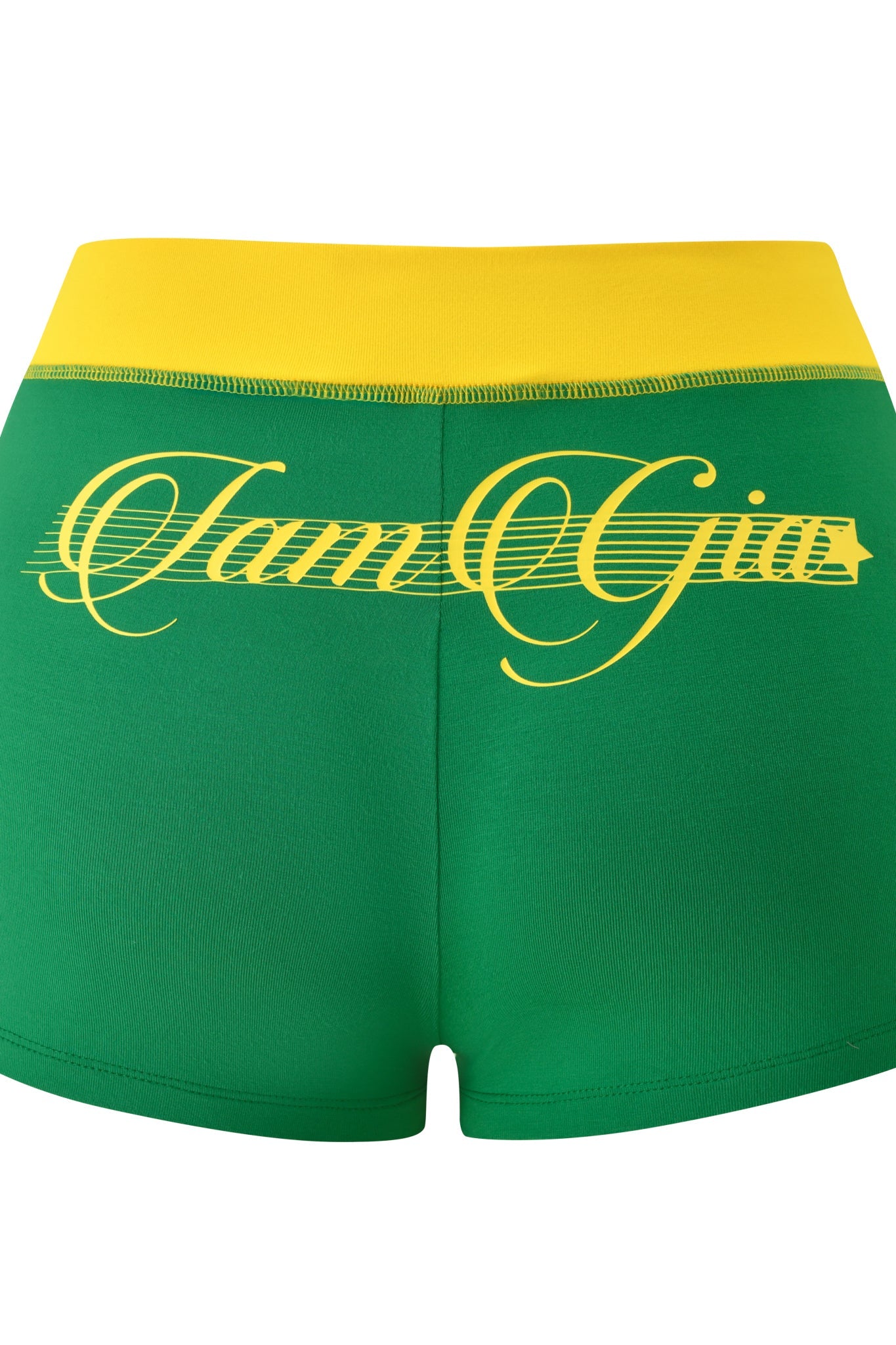 The BLARE PIPING SHORT - GREEN by I.AM.GIA features a yellow waistband and bold yellow "Jam Gya" cursive on the back, offering a sporty micro-short style.