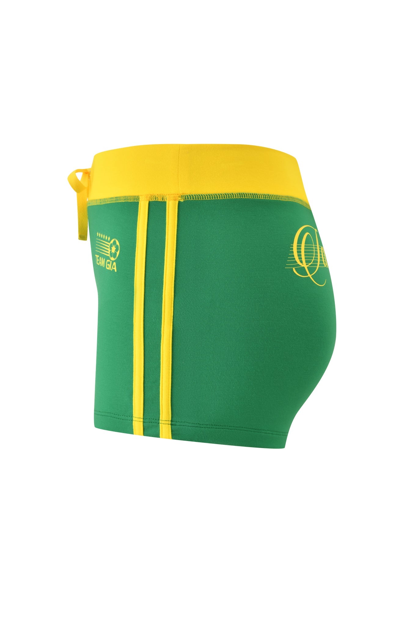 The I.AM.GIA BLARE PIPING SHORT - GREEN swim trunks feature a side tie, green and yellow design, two vertical yellow stripes, a circular back logo, and embody the brand's signature bold style. Shown from the left side.