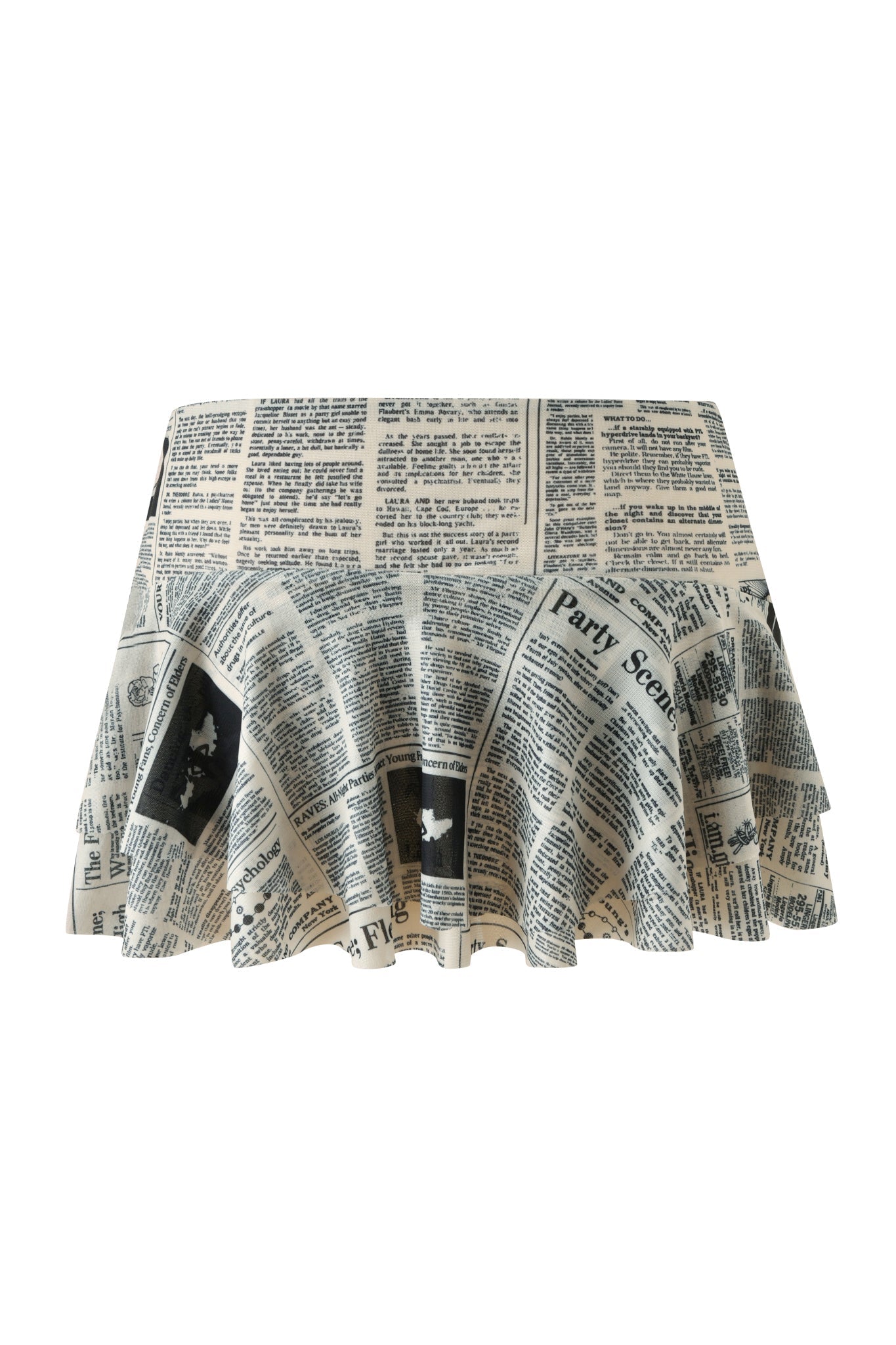Introducing the SORA MINI SKIRT - LEFT ON READ by I.AM.GIA, a low-rise mini skirt crafted in a striking black and white palette. Featuring bold newspaper-inspired headlines and text patterns throughout, this statement piece combines a modern silhouette with eye-catching style—perfect for turning heads wherever you go.