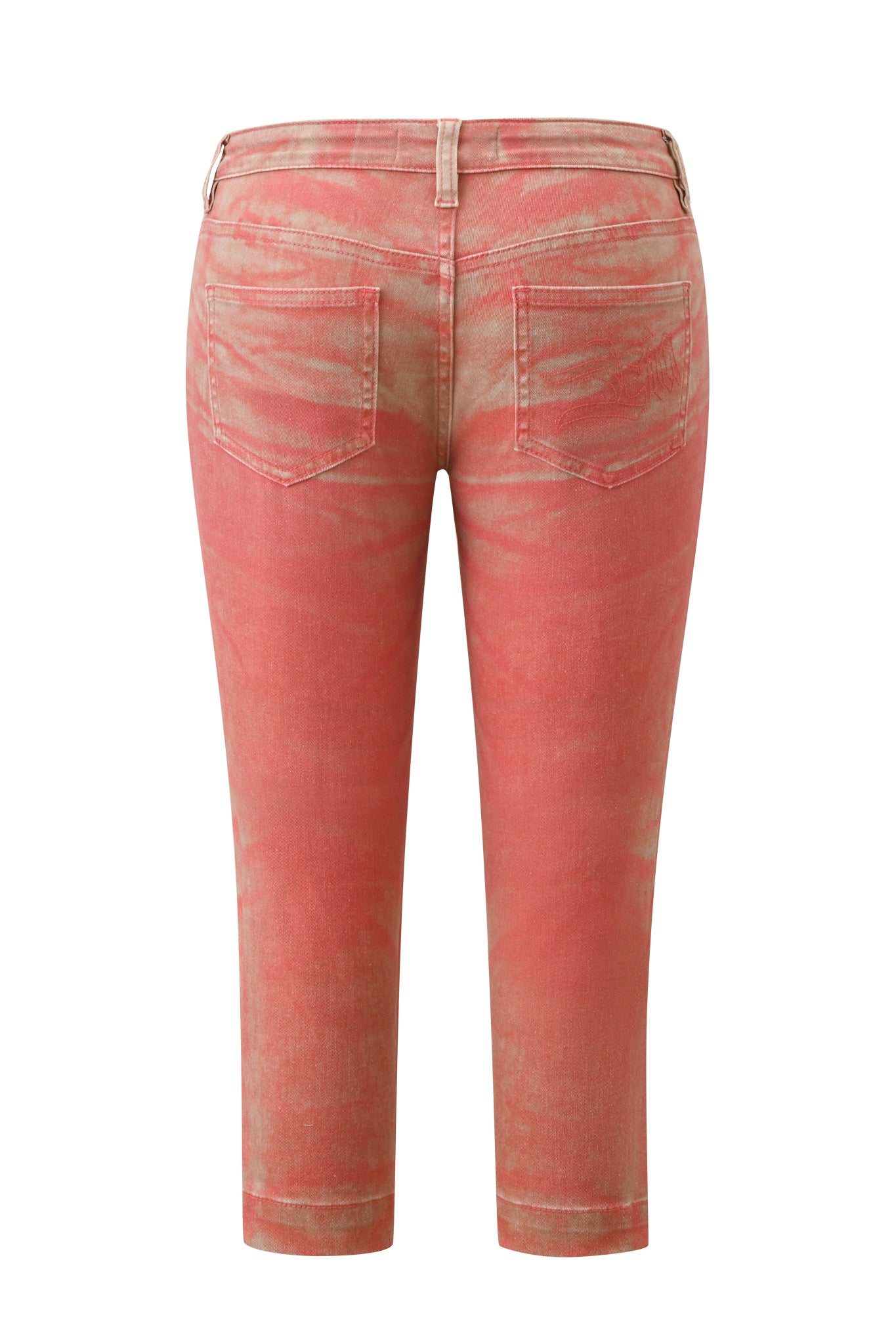 Back view of the SUNSET CAPRI JEAN - PEACH by I.AM.GIA, featuring a coral pink shade with a subtle peach ombré wash and faded effect. These mid-rise, stretch denim capri pants offer a casual, worn-in look with a straight leg cut, two back pockets, and belt loops.