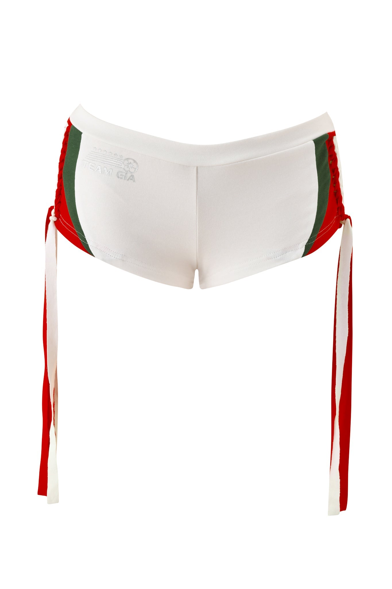 The NOVIA MICRO SPORT SHORT - WHITE by I.AM.GIA are sporty white stretch cotton shorts with green side panels, a low-rise waist, and long red drawstrings along the sides, shown against a plain white background.