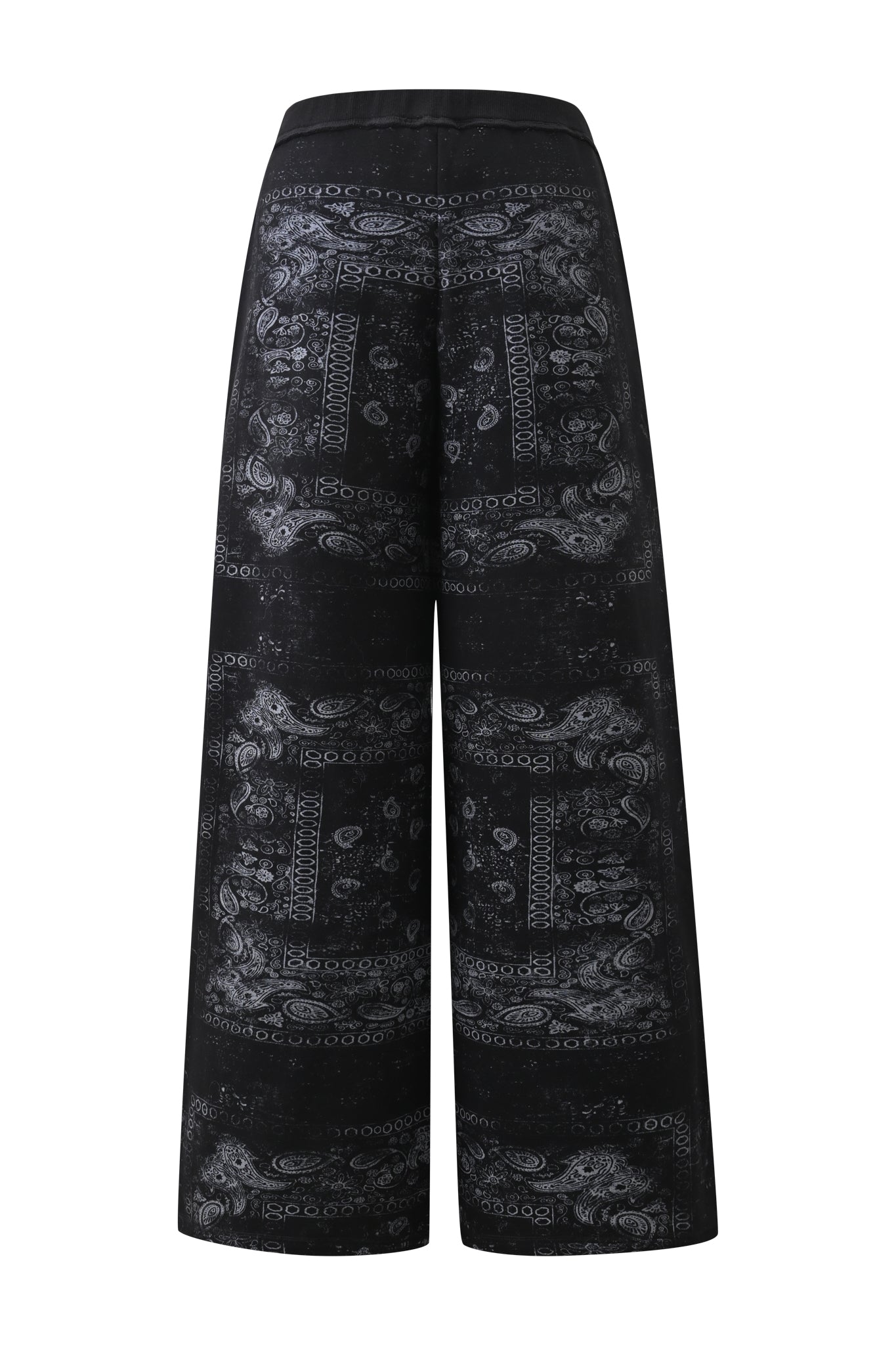 The I.AM.GIA T-REX TRACKPANT - BLACK BANDANA features a wide-leg silhouette with a subtle gray paisley and bandana print, showcased from the back against a crisp white background—an ideal choice for elevating your street style.