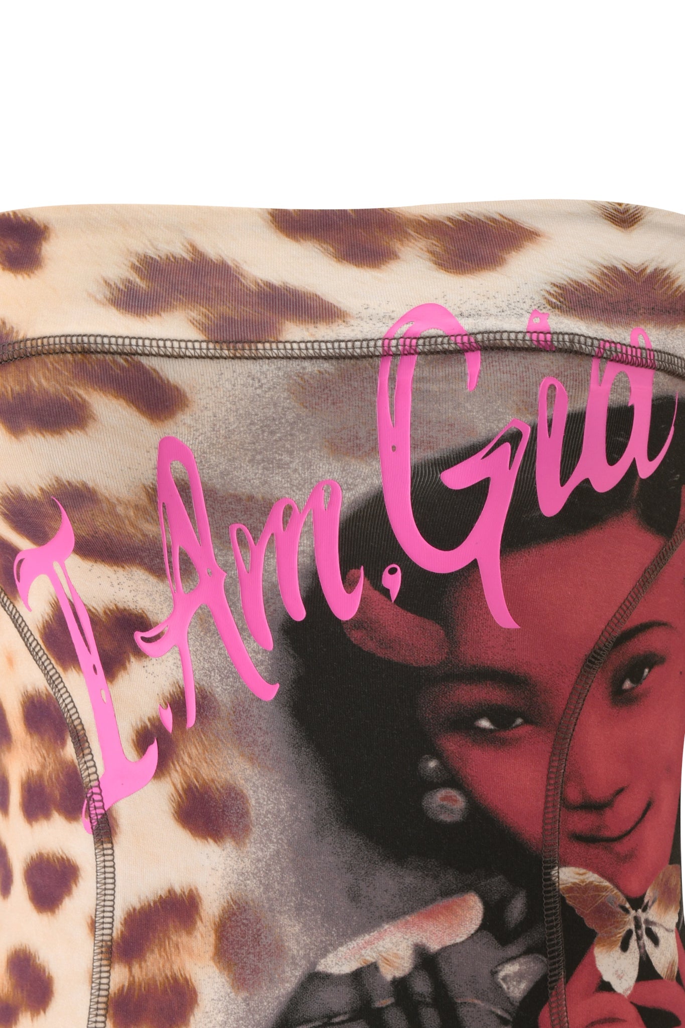 Close-up of the T-REX BLARE BOOB TUBE - WILD CARD by I.AM.GIA, showcasing fabric with a leopard print pattern, a vintage woman's face and hand, a butterfly motif, and pink handwritten "I Am Gia" text across the top—perfect for making a bold statement at any festival or as an iconic I.AM.GIA piece.