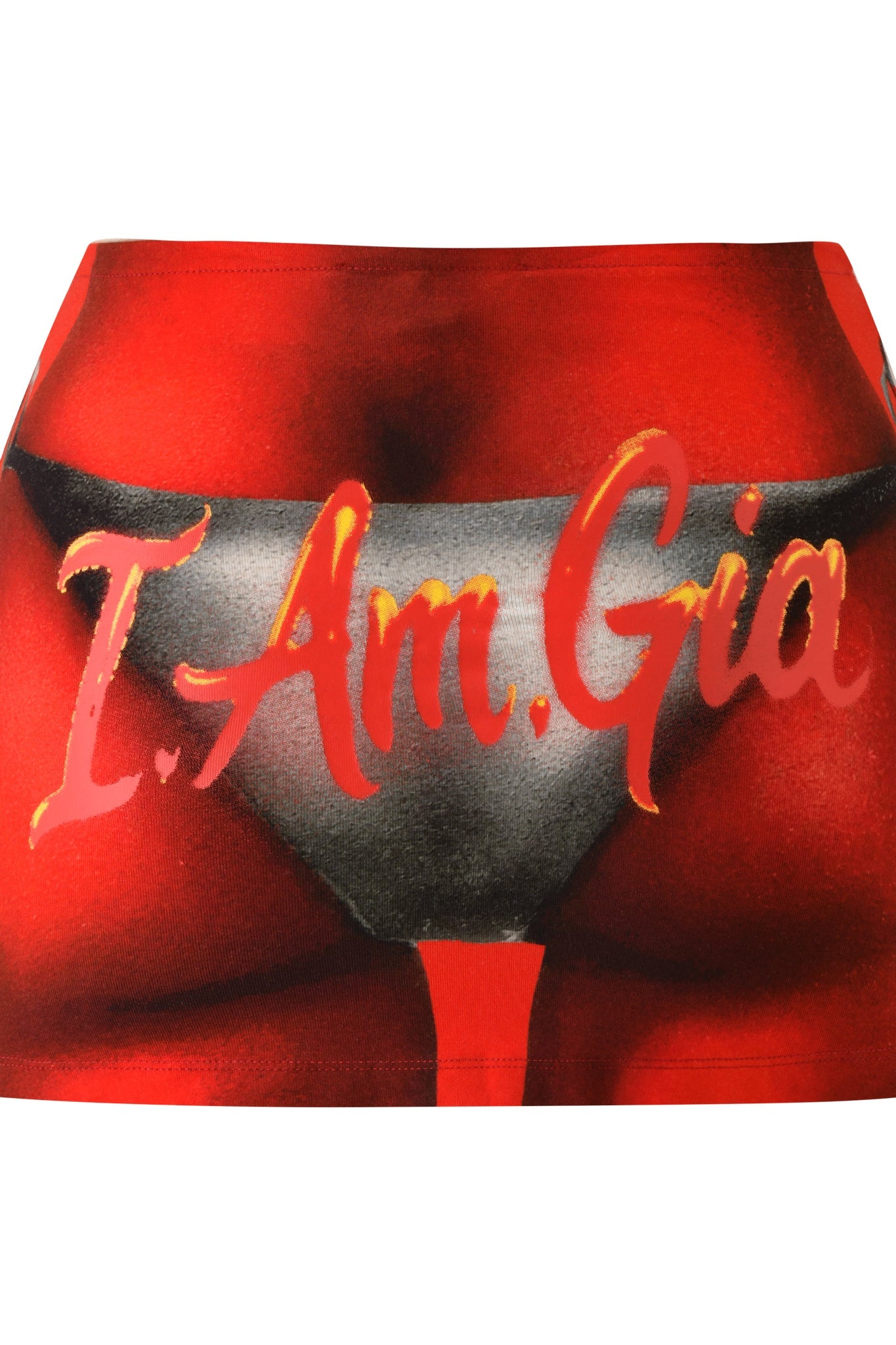 I.AM.GIA T-Rex Blare Mini Skirt in red, showcasing a striking airbrushed graphic of a woman's hips in black underwear and finished with oversized gold and red "I.AM.GIA" lettering across the front.