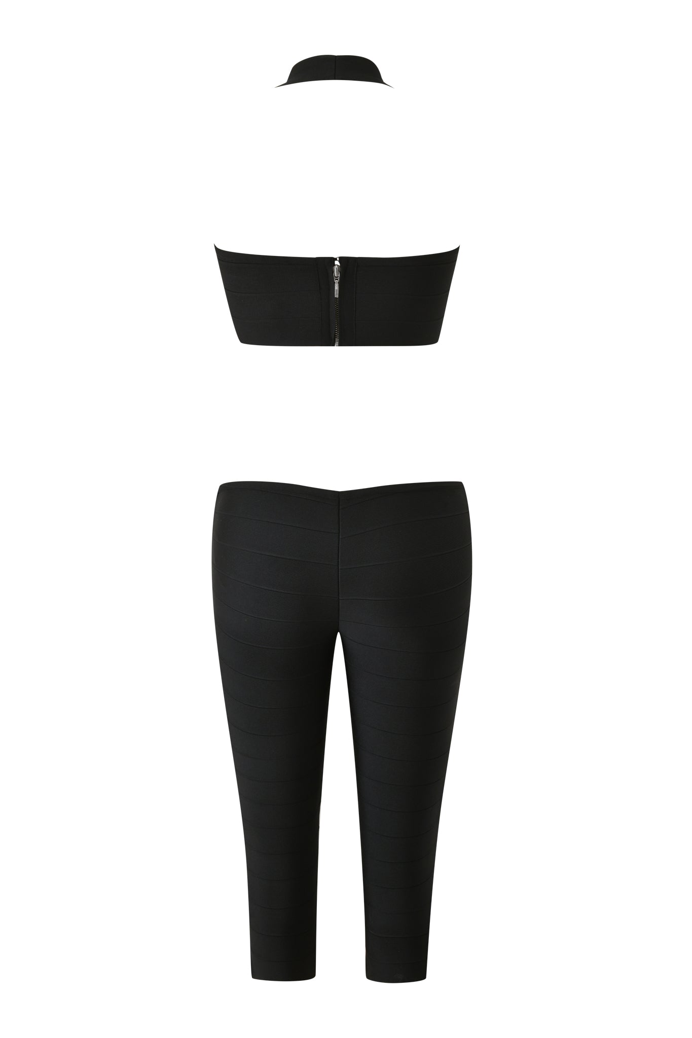 Back view of the I.AM.GIA EVA BANDAGE CAPRI JUMPSUIT in black, featuring a strapless crop top with zipper detail and high-waisted, ankle-length fitted pants.