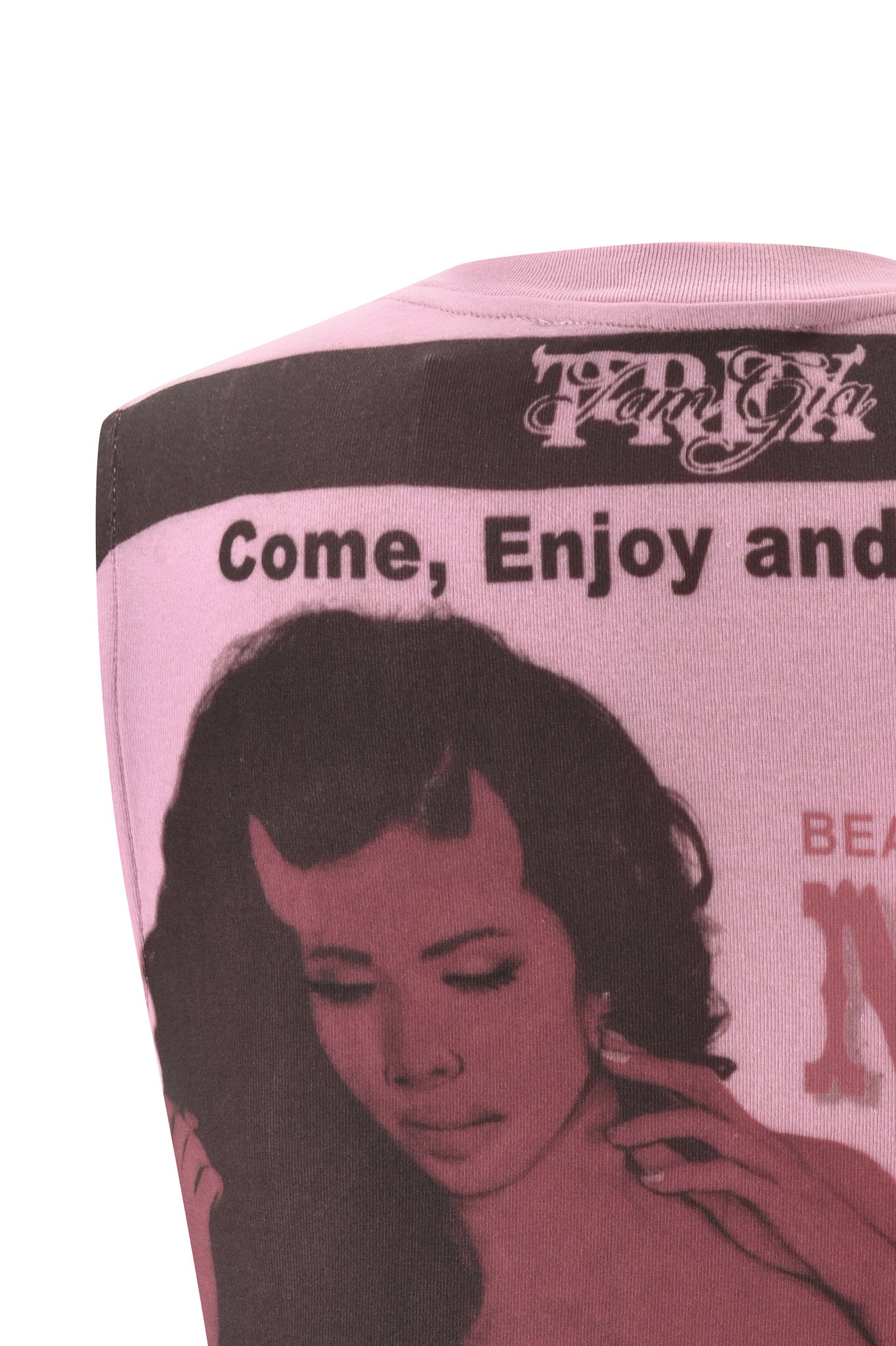 A close-up of the I.AM.GIA T-REX COURTNEY TANK in baby pink, featuring a retro-inspired graphic of a woman's head and hand, along with bold black text that reads "Come, Enjoy and.