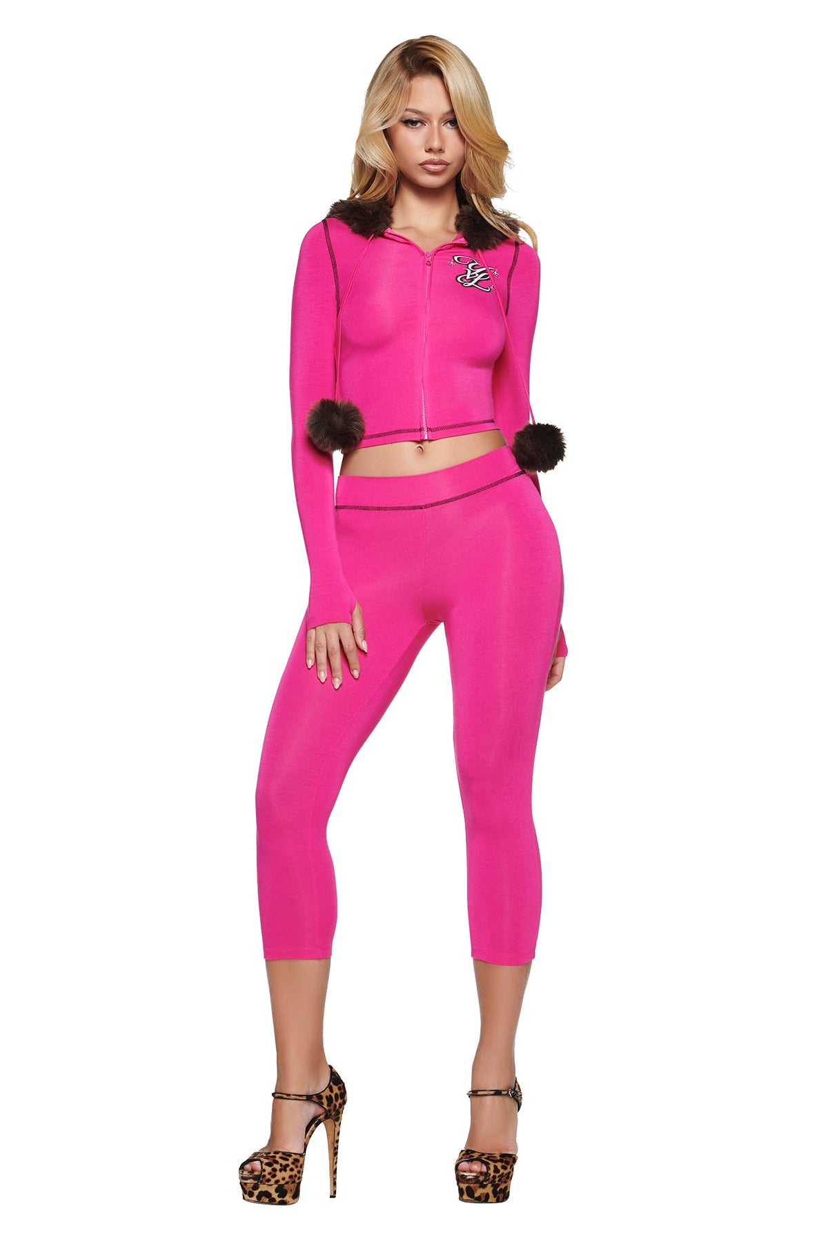 A model wearing a bright pink I.AM.GIA YVL BLARE FUR LINED HOODIE with a dark faux-fur trim on the hood and matching cropped leggings.