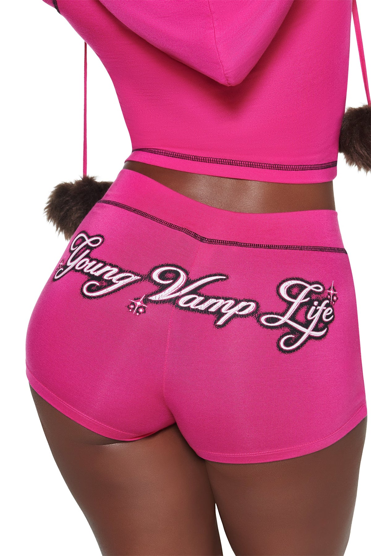 Bright pink I.AM.GIA YVL BLARE SHORT festival shorts with “Young Vamp Life” embroidered across the back in black and white cursive lettering.