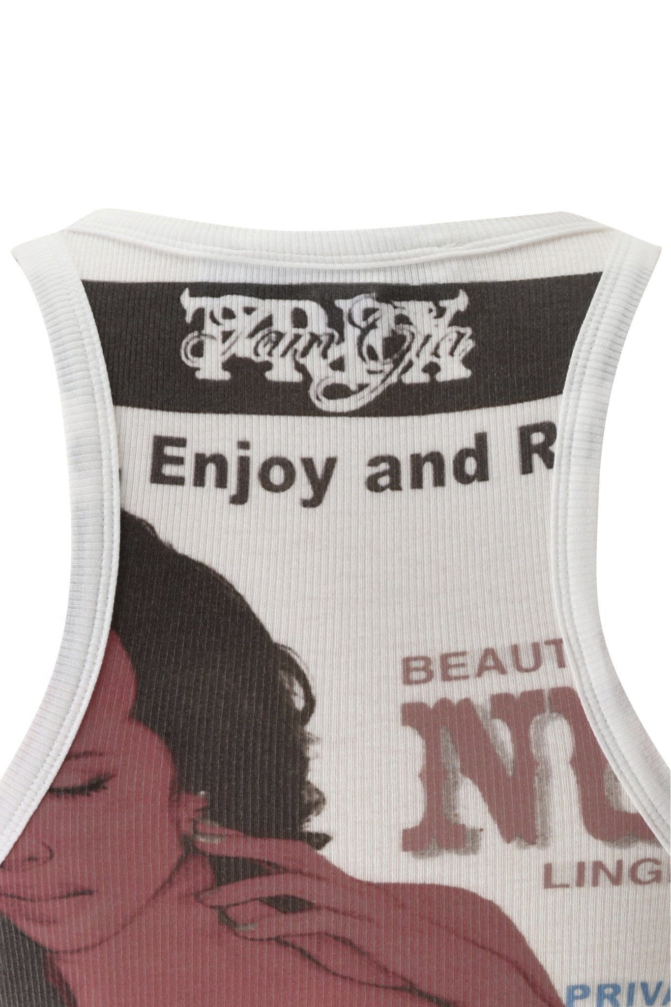 A close-up of the I.AM.GIA T-REX PENELOPE TANK in white, showcasing bold black and red I.AM.GIA print text and a partial image of a woman’s face. Visible phrases such as “Enjoy and R” and “BEAUT.” make this racer tank top an ideal choice for summer festivals.